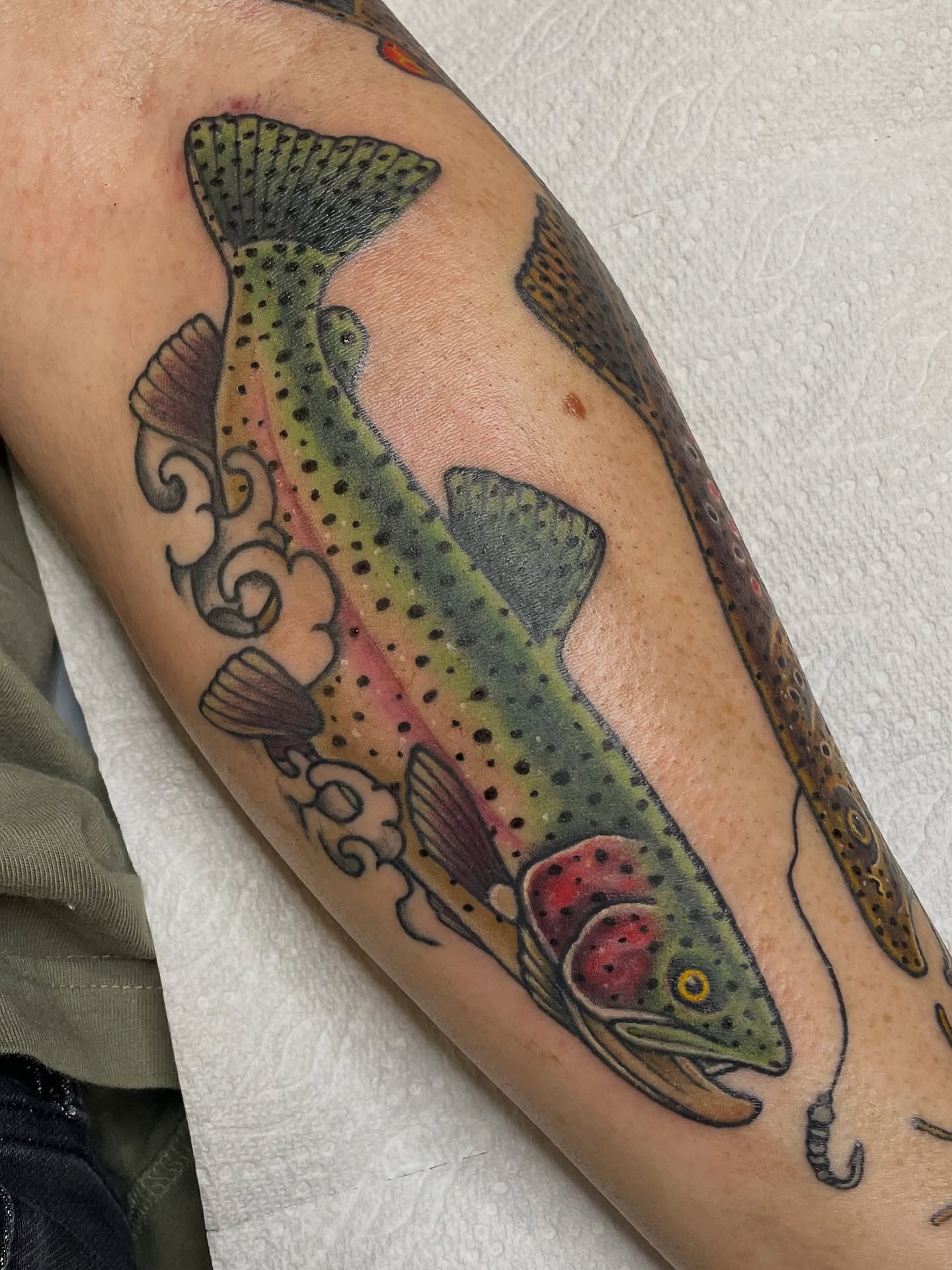 Rainbow trout American traditional tattoo on the forearm by πΌπ
ππΎπππππ