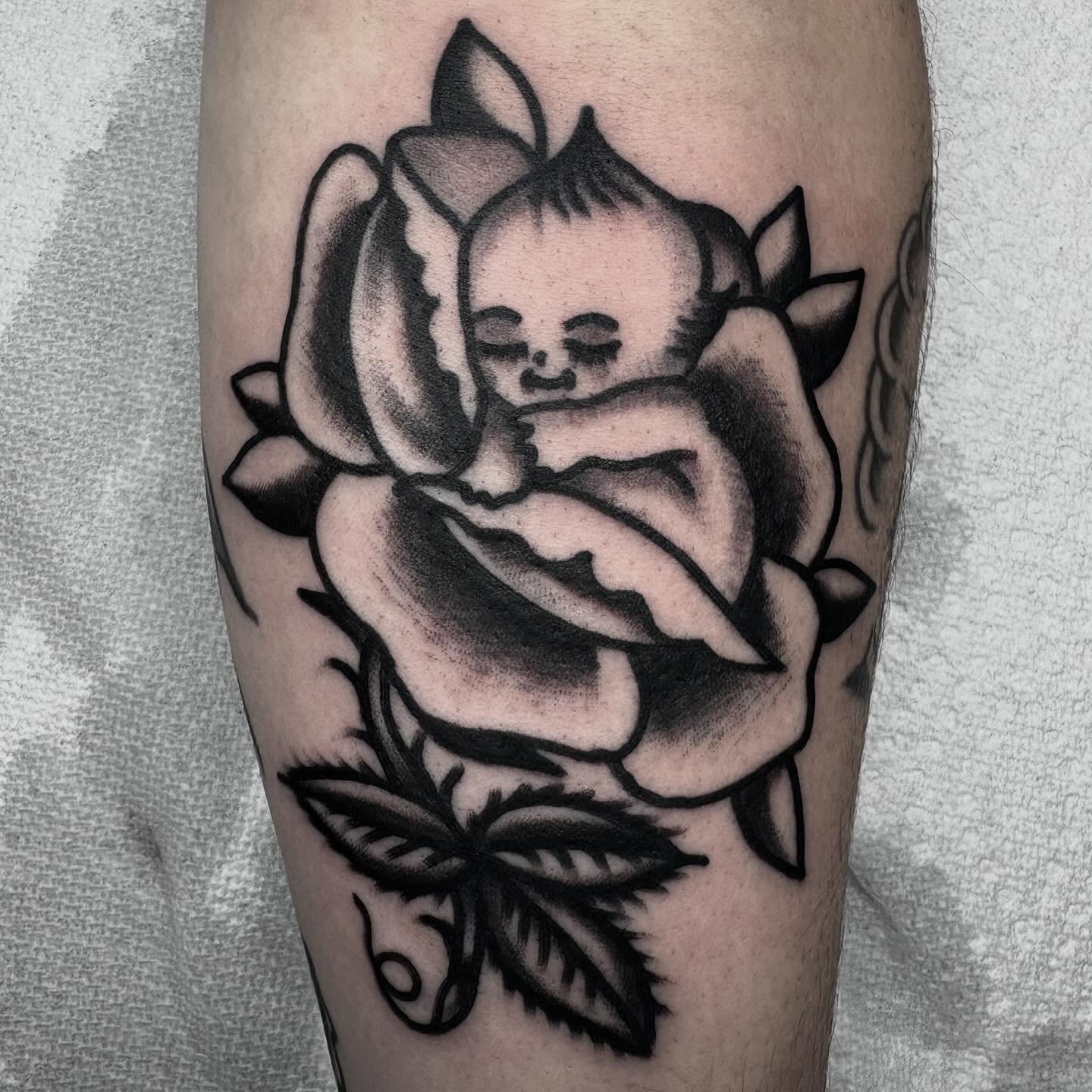Baby in rose American traditional tattoo on the forearm by π³πππ πΆπππππ