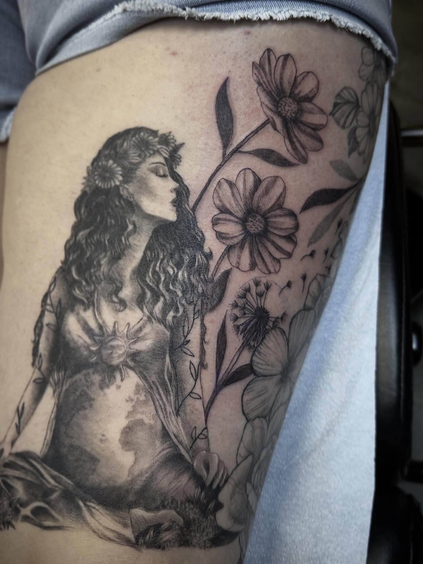 Woman with flowers black and grey tattoo on the thigh by 🌜🔮✨Anya Casey✨🔮🌛