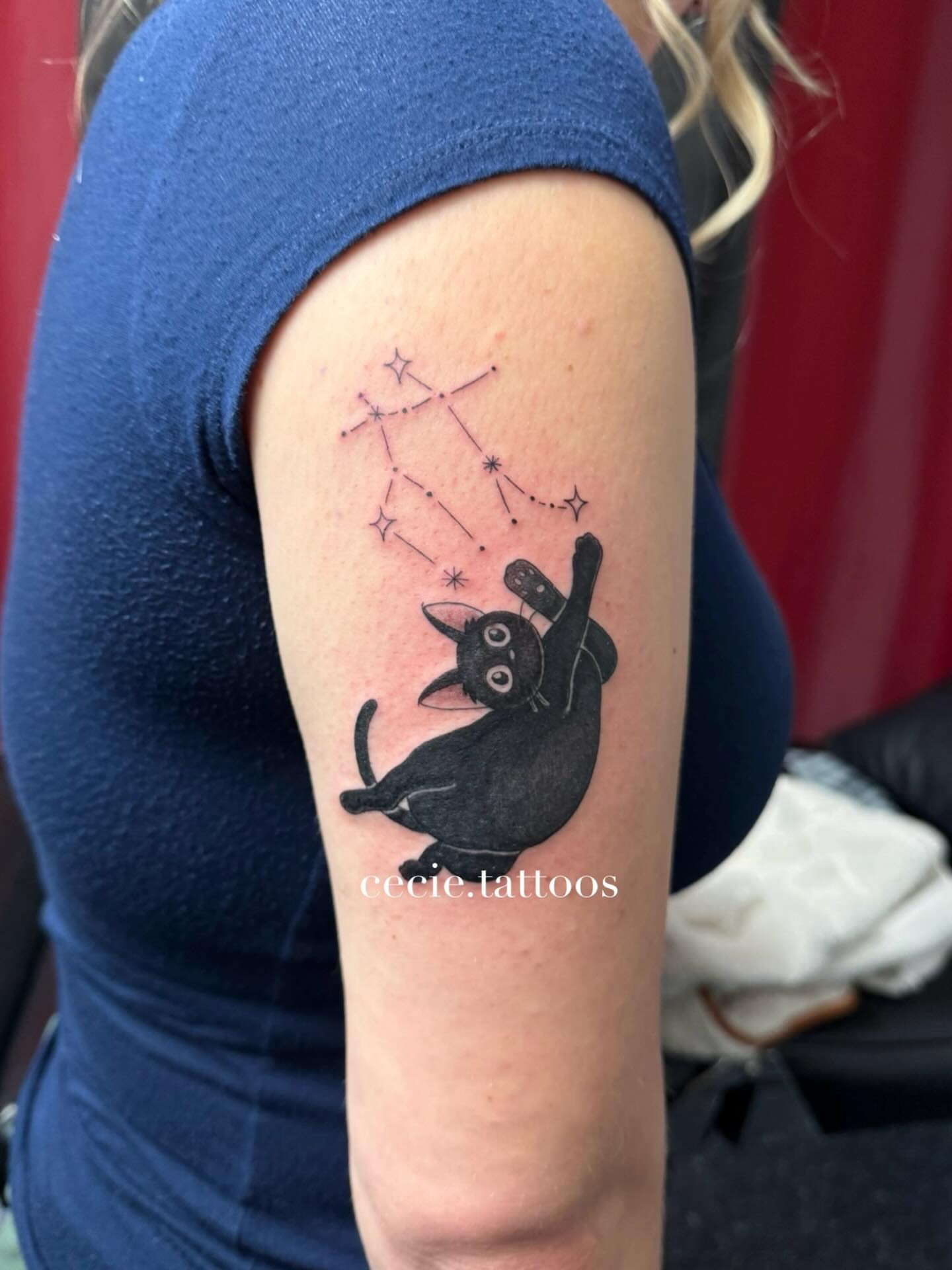 Cat constellation realism tattoo on the upper arm by cecie moua