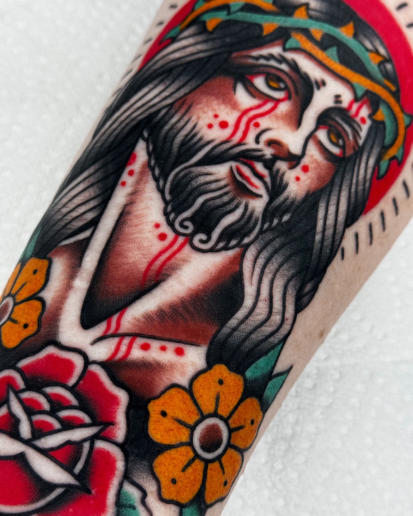 Religious figure American traditional tattoo on the forearm by Samuel Dickey