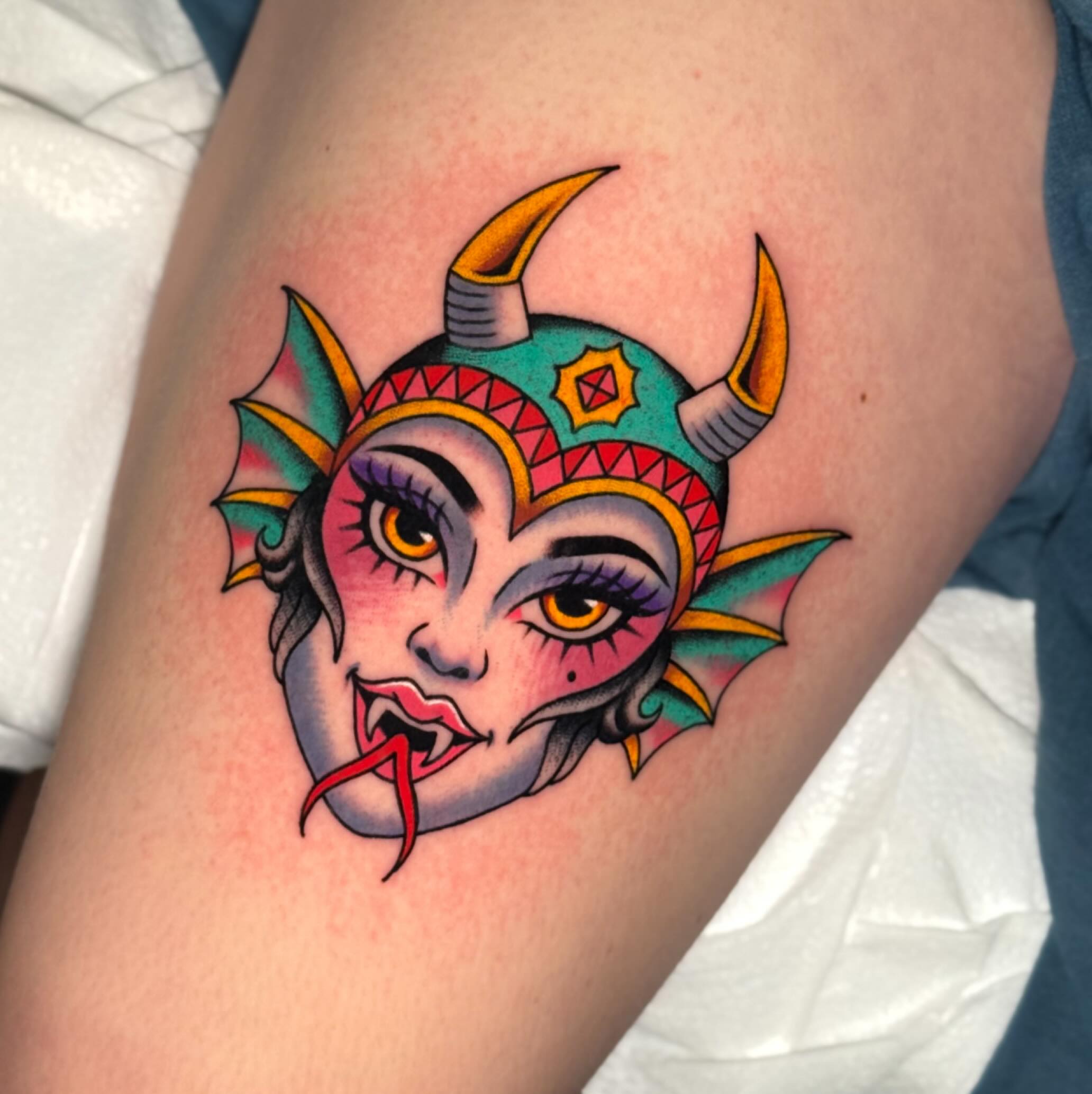 Demon mask American traditional tattoo on the thigh by Chelstine, Encinitas, California