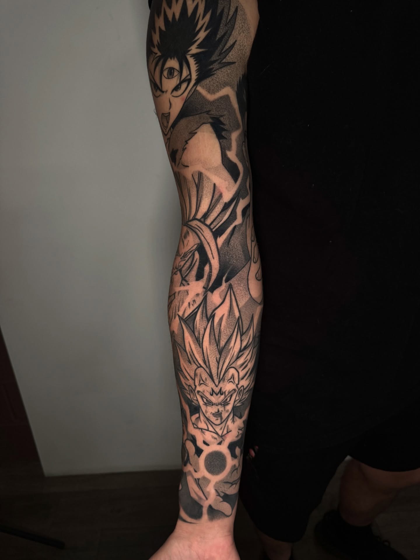 Anime characters anime tattoo on the forearm by Anthony D. Rustik