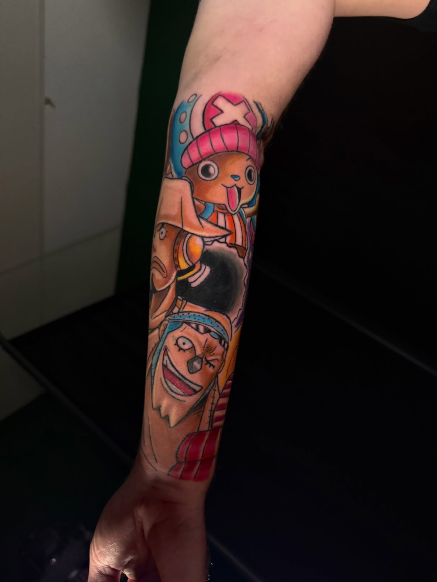 Anime characters anime tattoo on the forearm by joshua sides