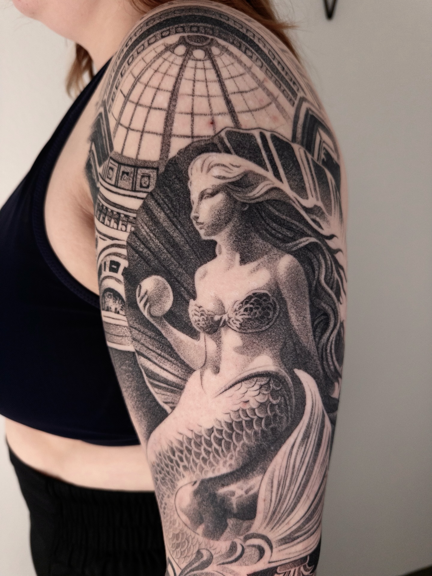 Mermaid realism tattoo on the upper arm by sacramento tattoo CA