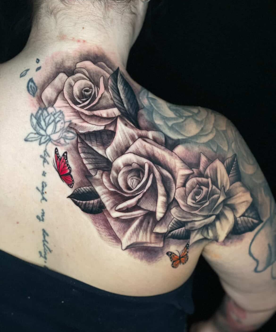 Roses and butterflies realism tattoo on the chest by Shaunboweink