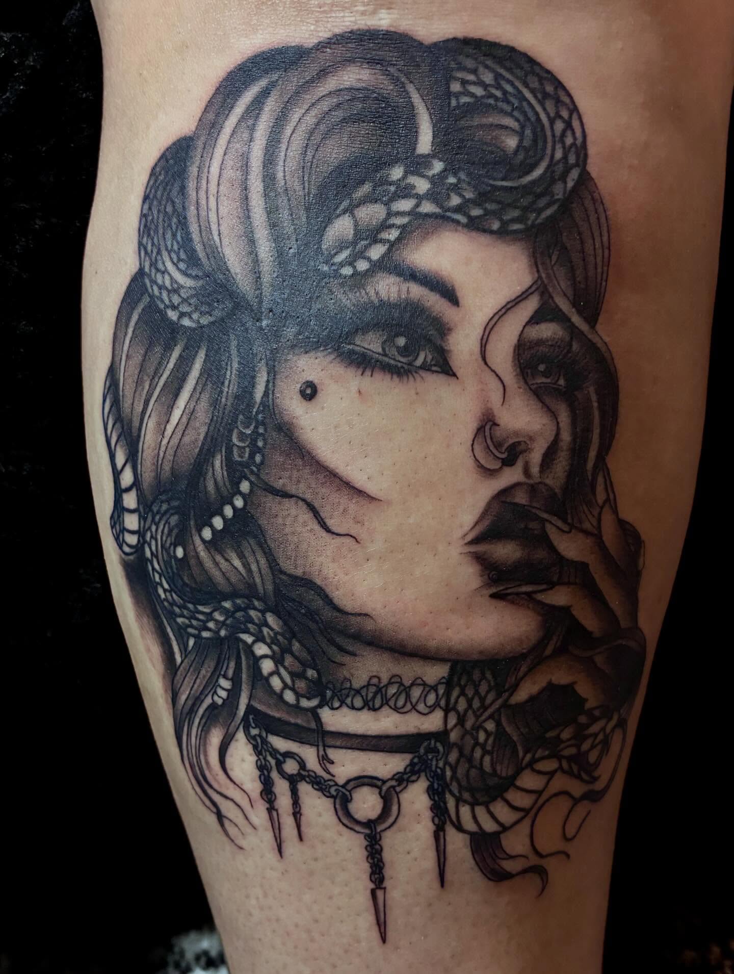 Woman with snake realism tattoo on the forearm by Nessa, Las Vegas, Nevada
