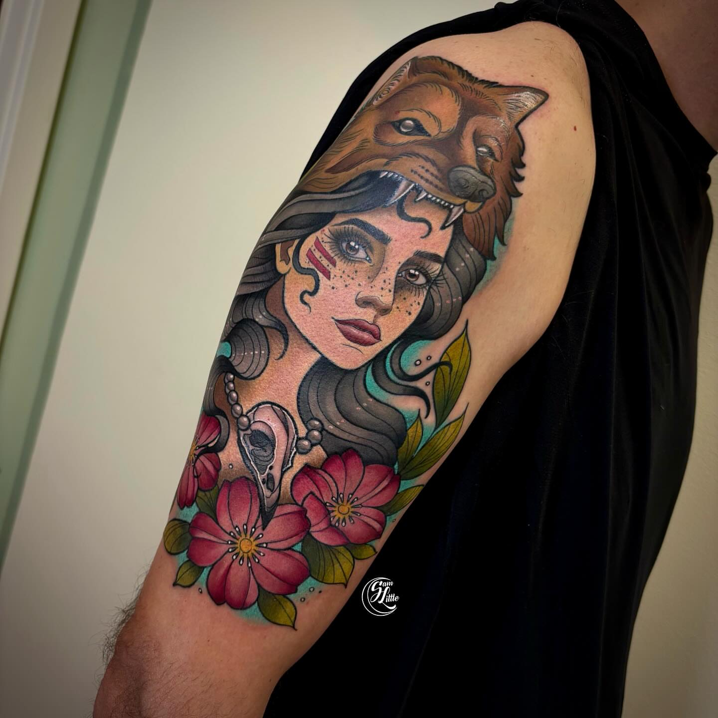 Woman with wolf American traditional tattoo on the upper arm by 𝓢𝓪𝓶 𝓛𝓲𝓽𝓽𝓵𝓮