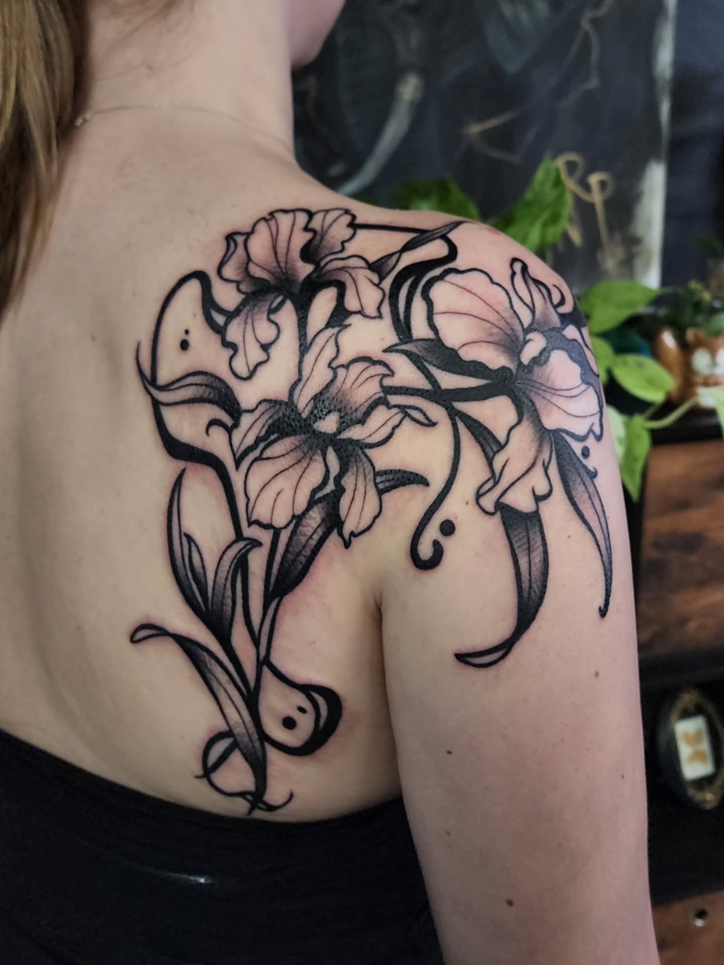 Lilies black and grey tattoo on the shoulder by Shawna Goettsche
