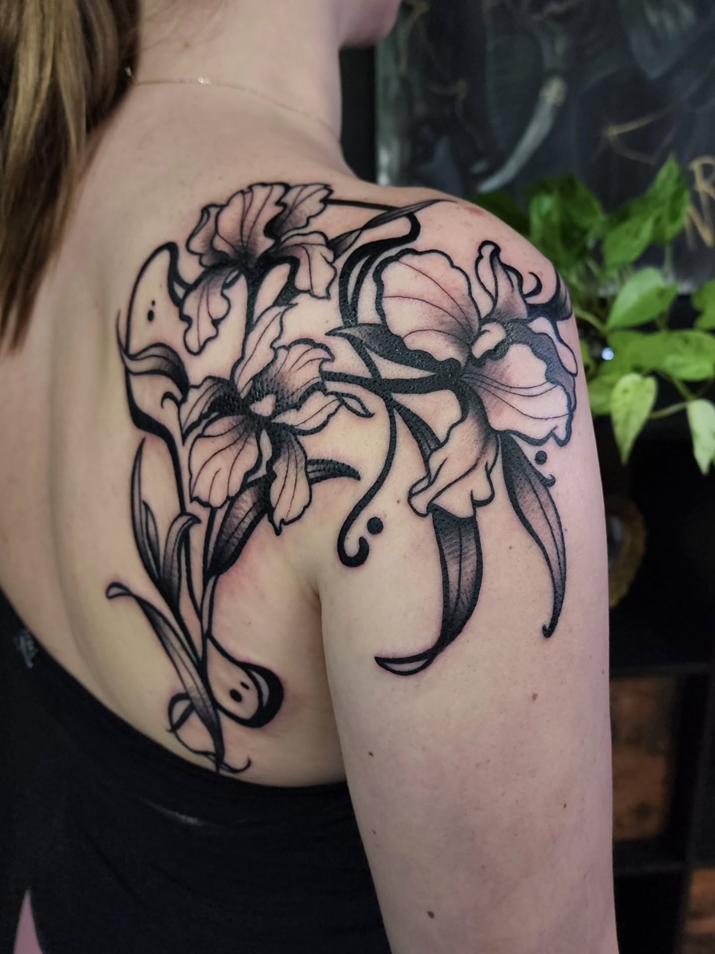 Floral arrangement black and grey tattoo on the shoulder by Shawna Goettsche
