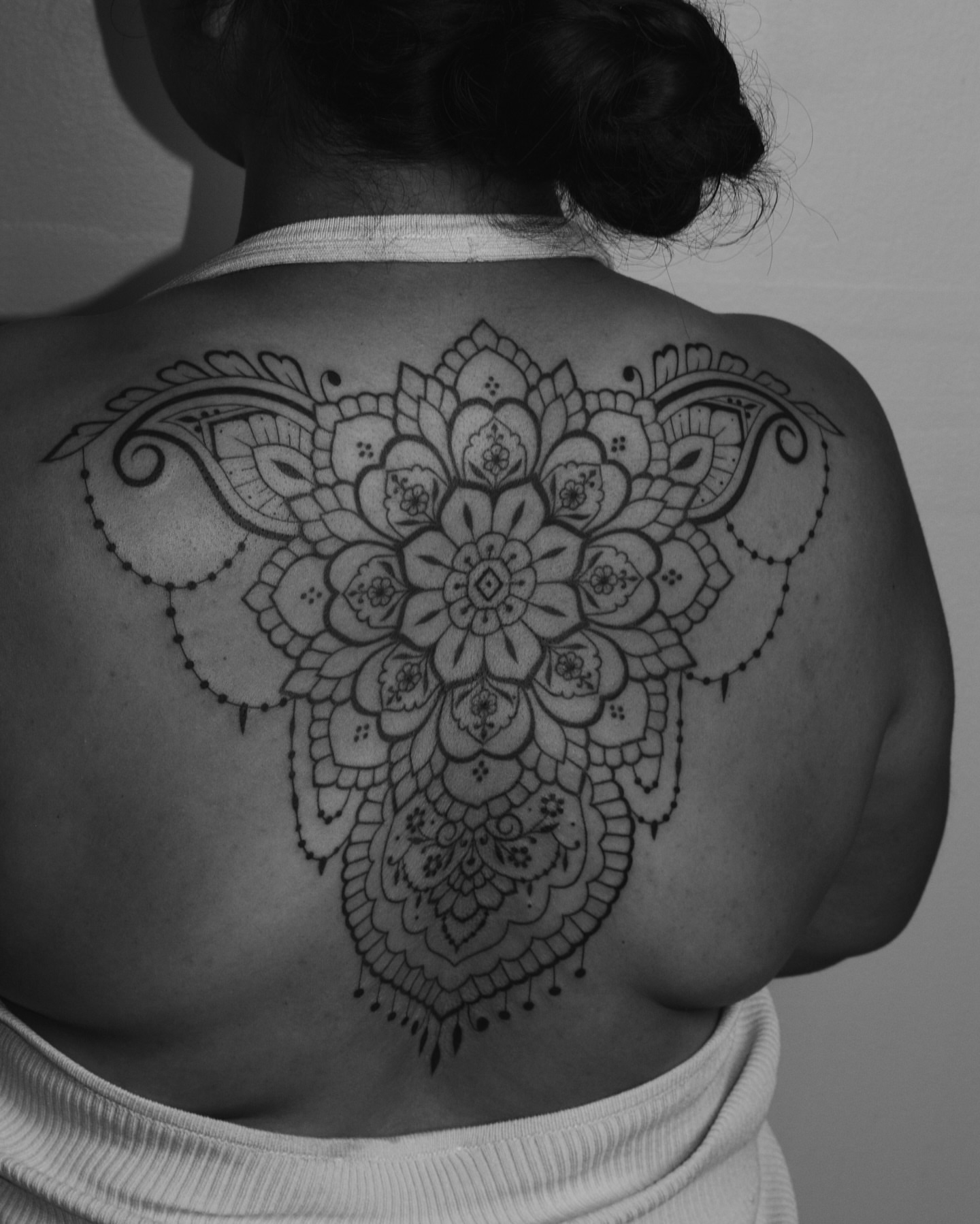 Mandala ornamental tattoo on the back by Sabreena Haque