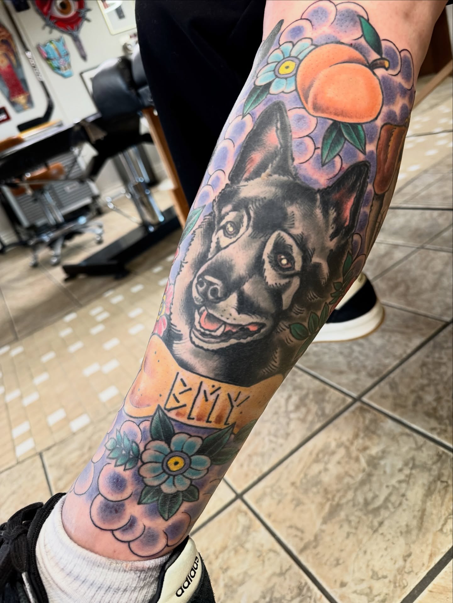 German Shepherd American traditional tattoo on the forearm by Cary Aldridge