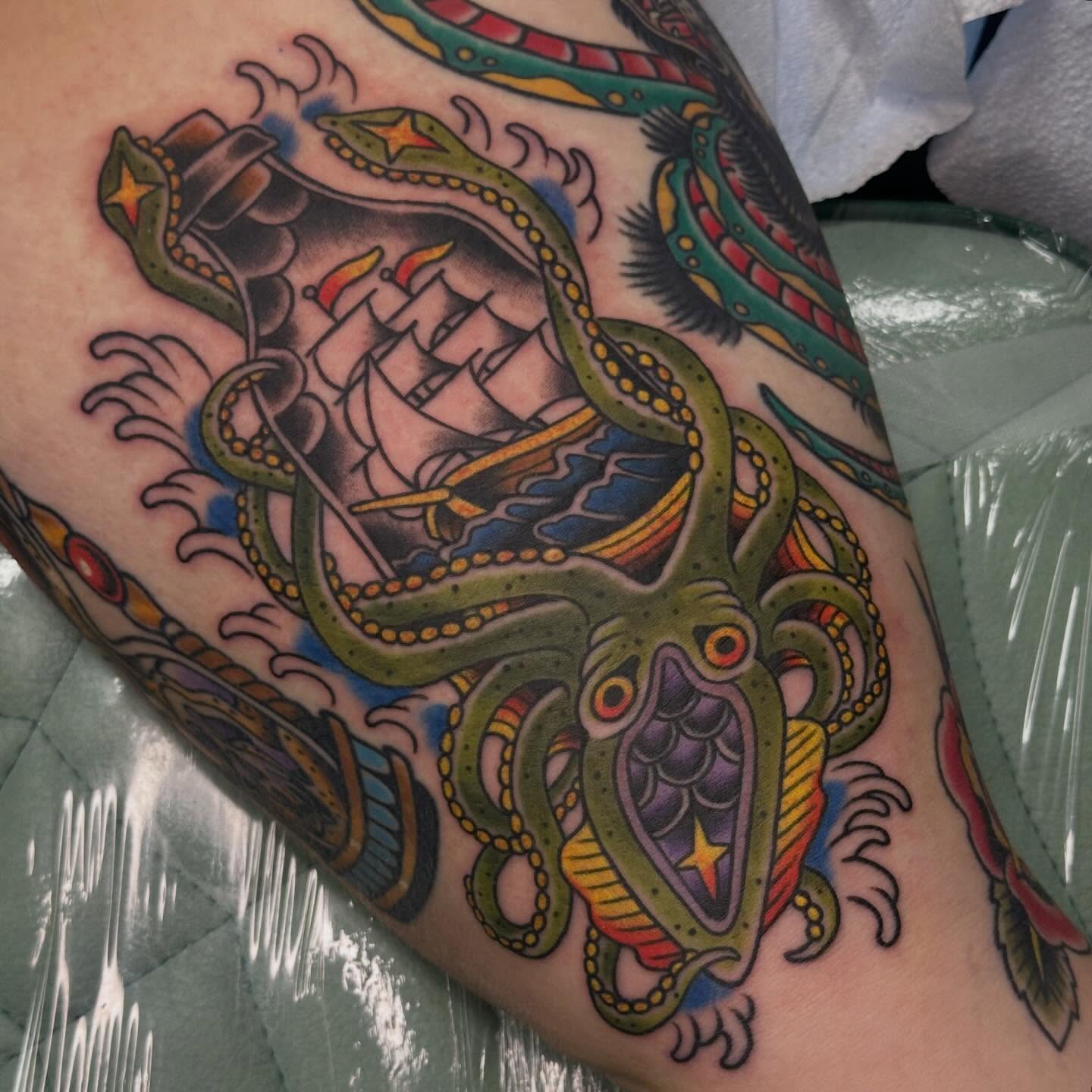 Octopus and ship American traditional tattoo on the forearm by Sammy Beresford