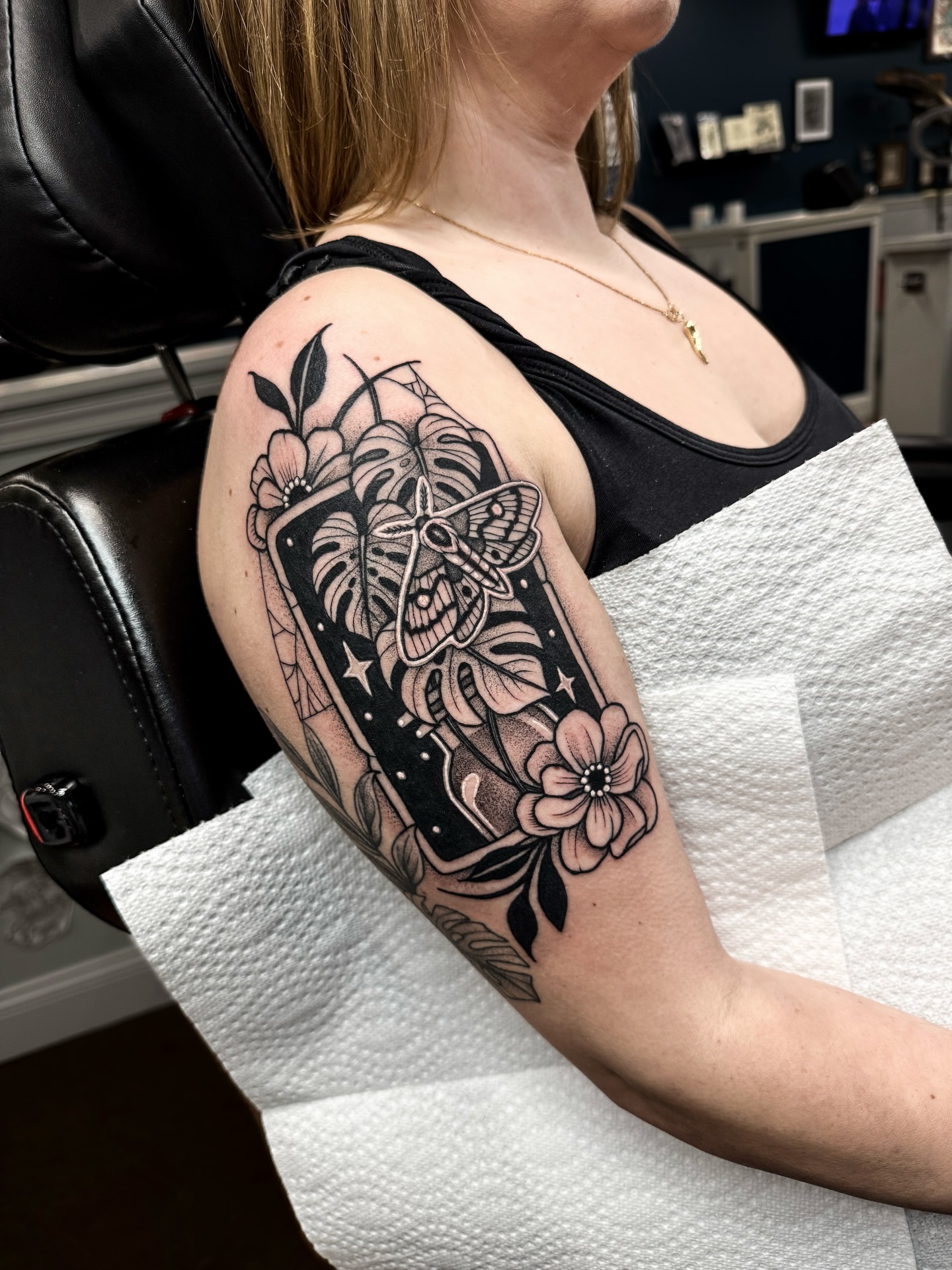 Moth and floral arrangement American traditional tattoo on the forearm by ⚡️ Krissy Fabis ⚡️