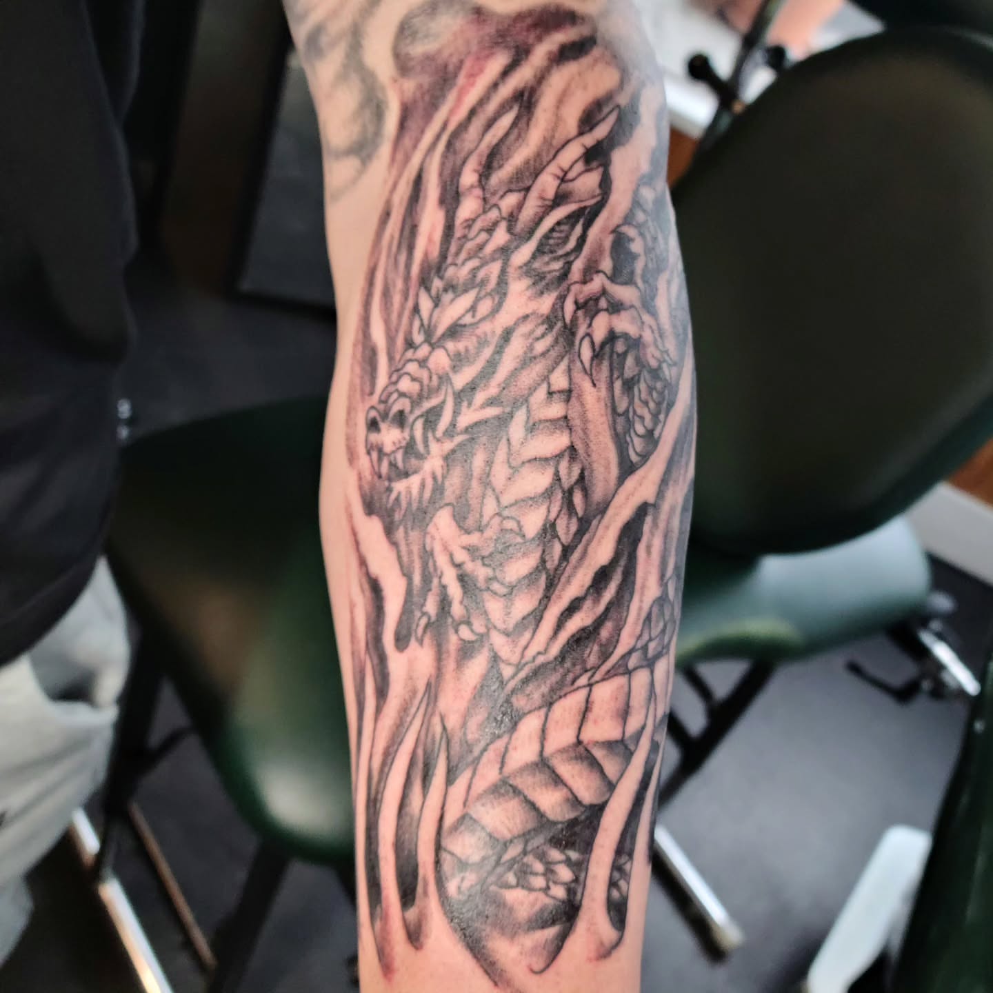 Dragon realism tattoo on the forearm by Adam Lunoe, Seattle, Washington