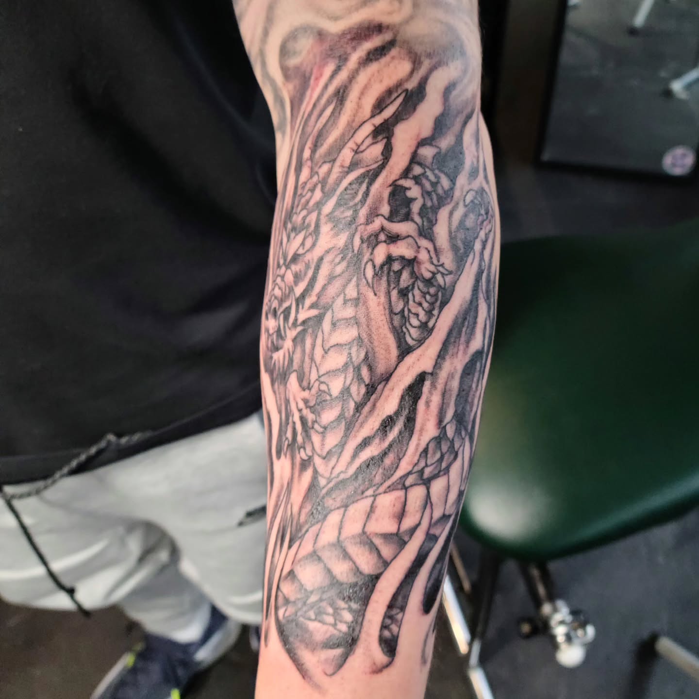 Dragon realism tattoo on the forearm by Adam Lunoe, Seattle, Washington