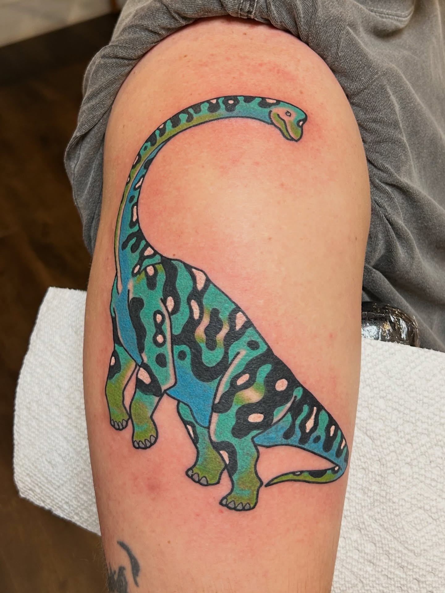 Dinosaur new school tattoo on the thigh by Lauren Alexandra