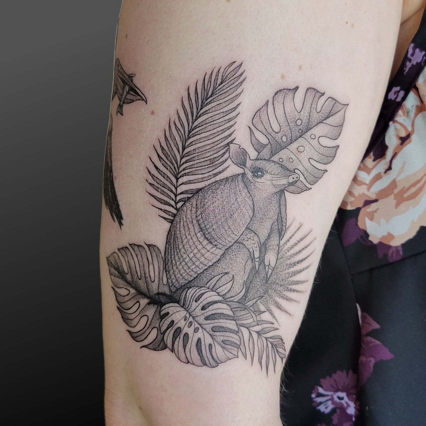 Armadillo and tropical leaves dotwork tattoo on the forearm by Arick Reese