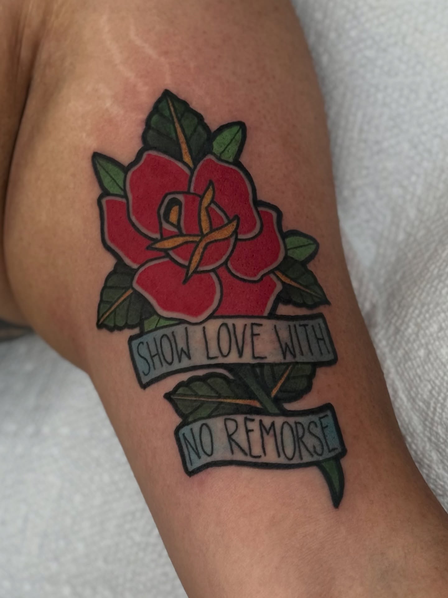 Red rose with banner American traditional tattoo on the forearm by T Dubs ✏️