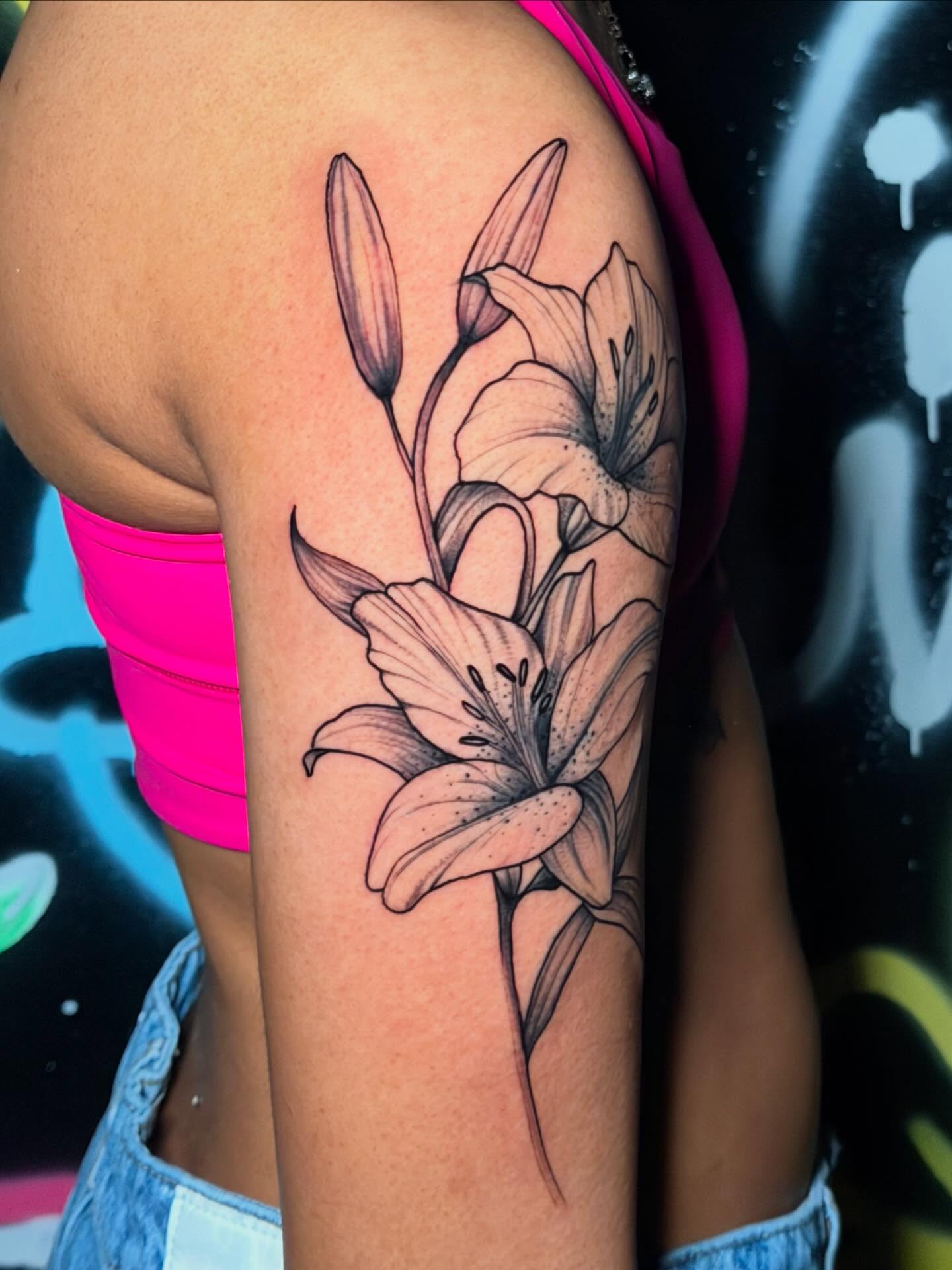 Lily dotwork tattoo on the forearm by Kbtattz