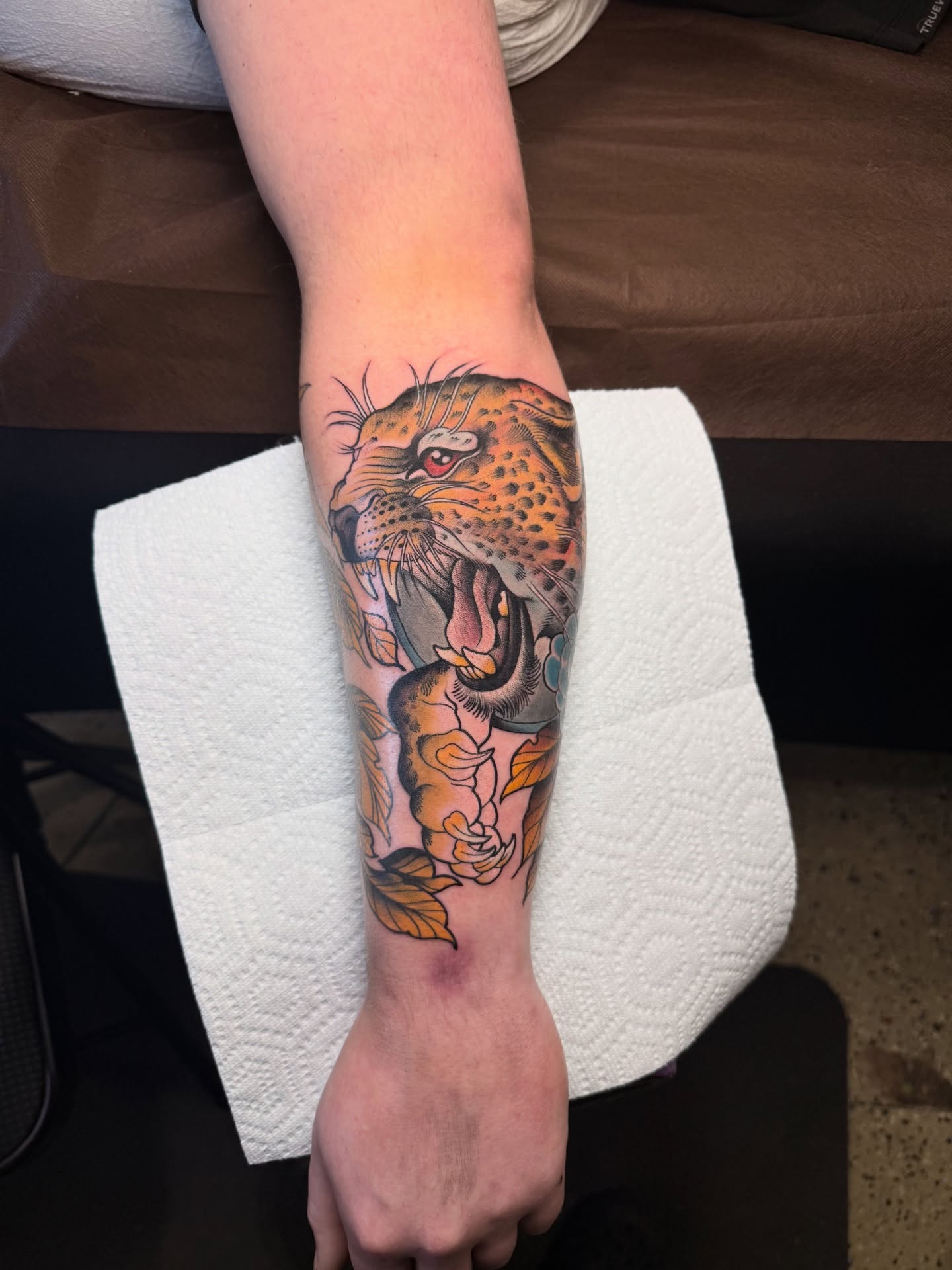 Leopard realism tattoo on the forearm by Jhon