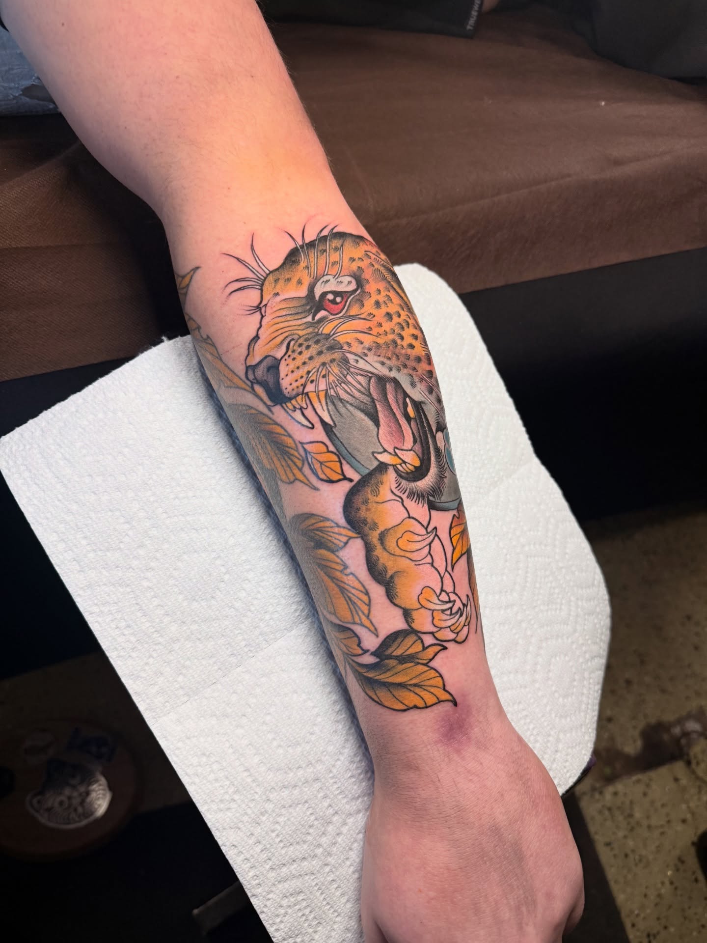 Leopard American traditional tattoo on the forearm by Jhon