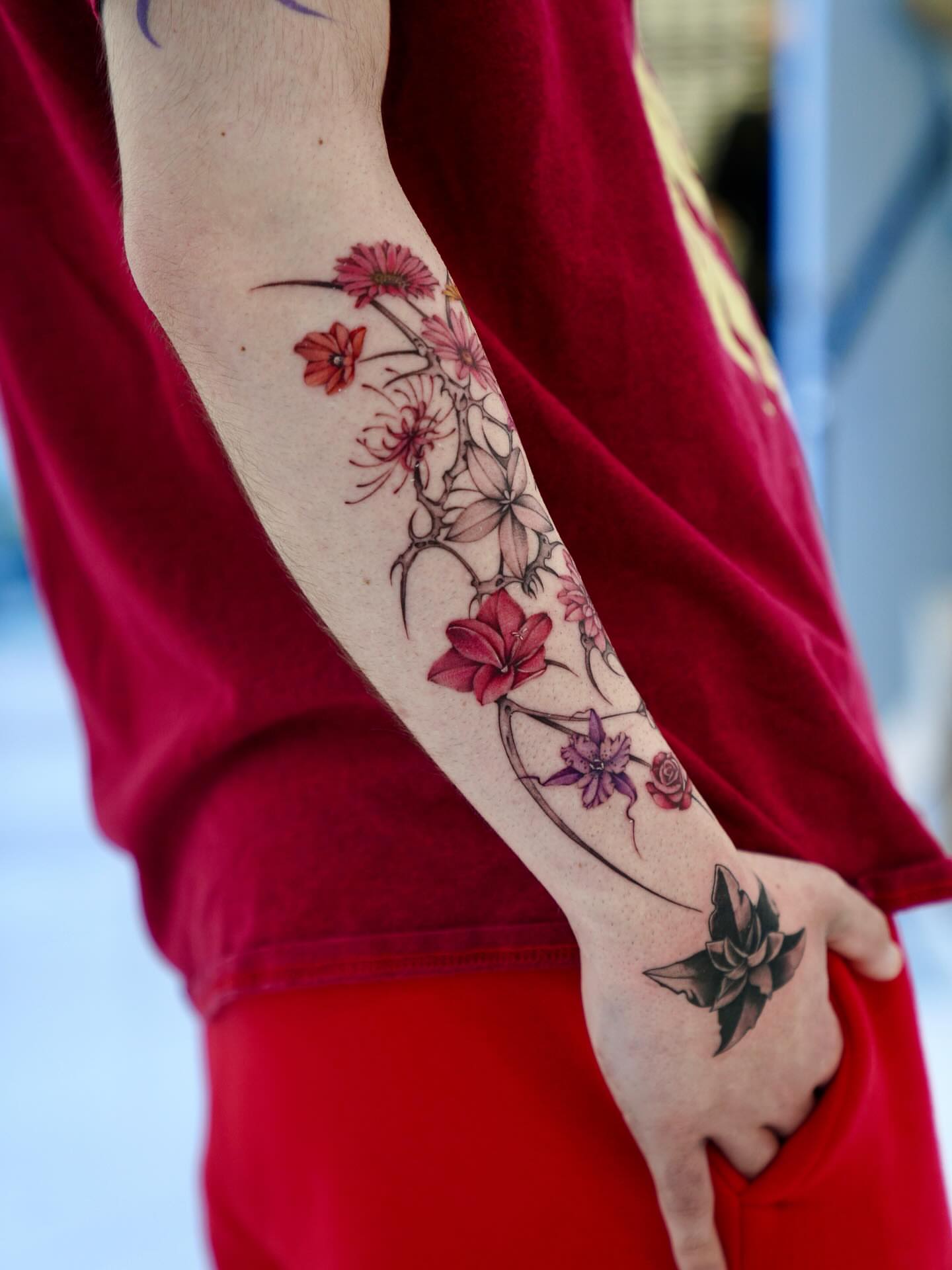 Floral arrangement realism tattoo on the forearm by Raytattooist