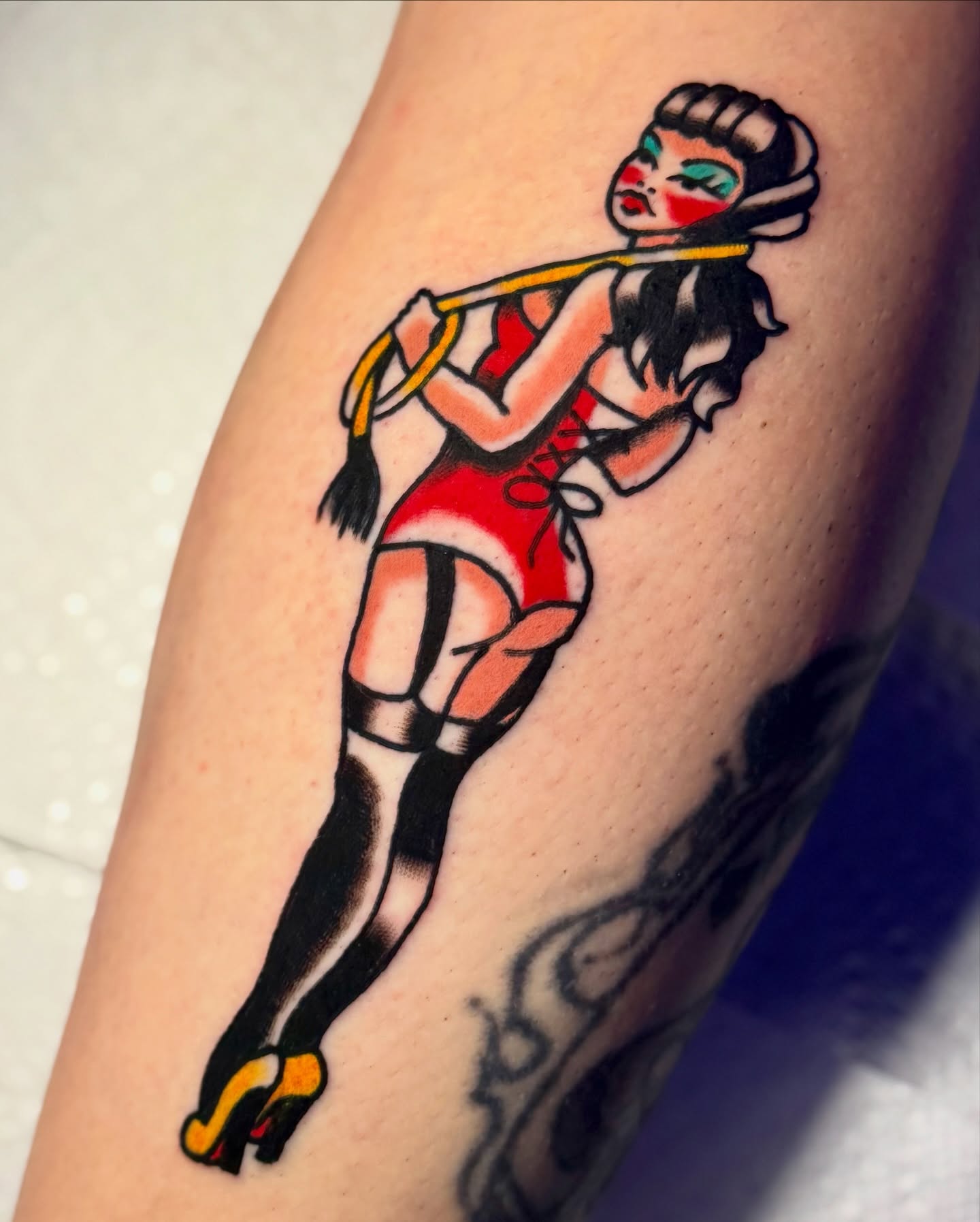 Pin-up girl American traditional tattoo on the thigh by Javin Klingelhoefer Mosley