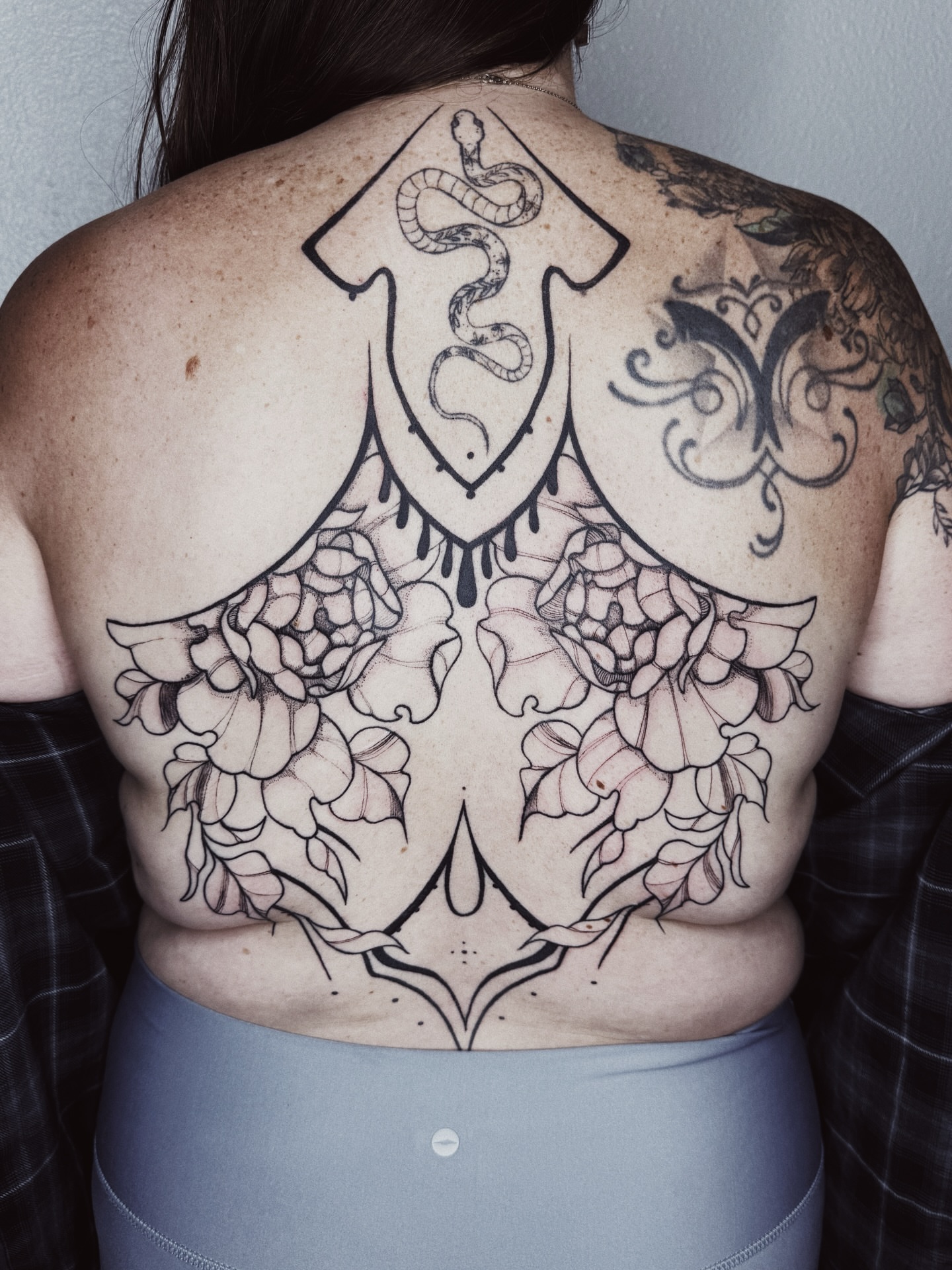 Peony and shield black and grey tattoo on the back by πΉπ°π½πππ΄π½ πΆπ»π΄π½π½, North Logan, Utah