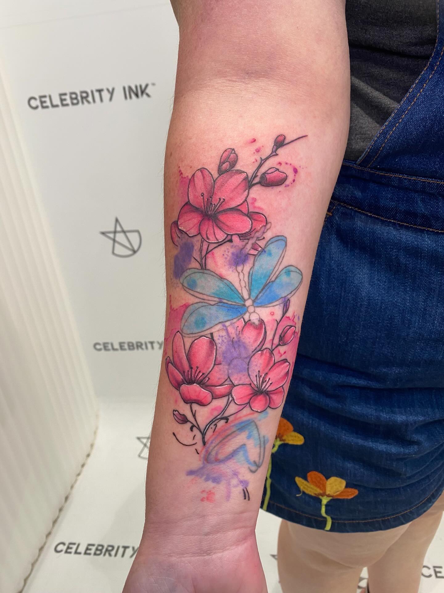 Watercolor flowers watercolor tattoo on the forearm by @dom_macio_tattoo