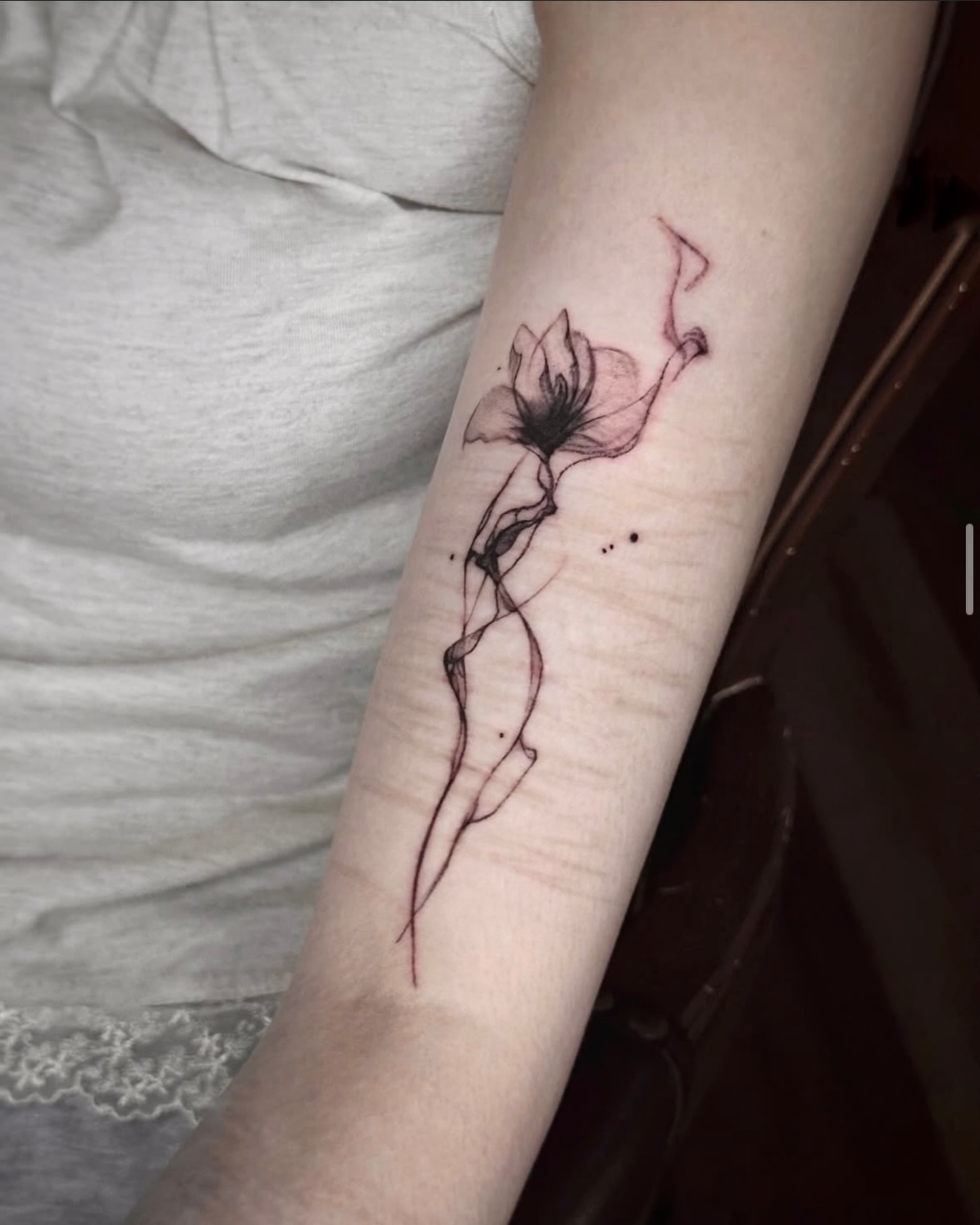 Flower dotwork tattoo on the forearm by @ashencoil