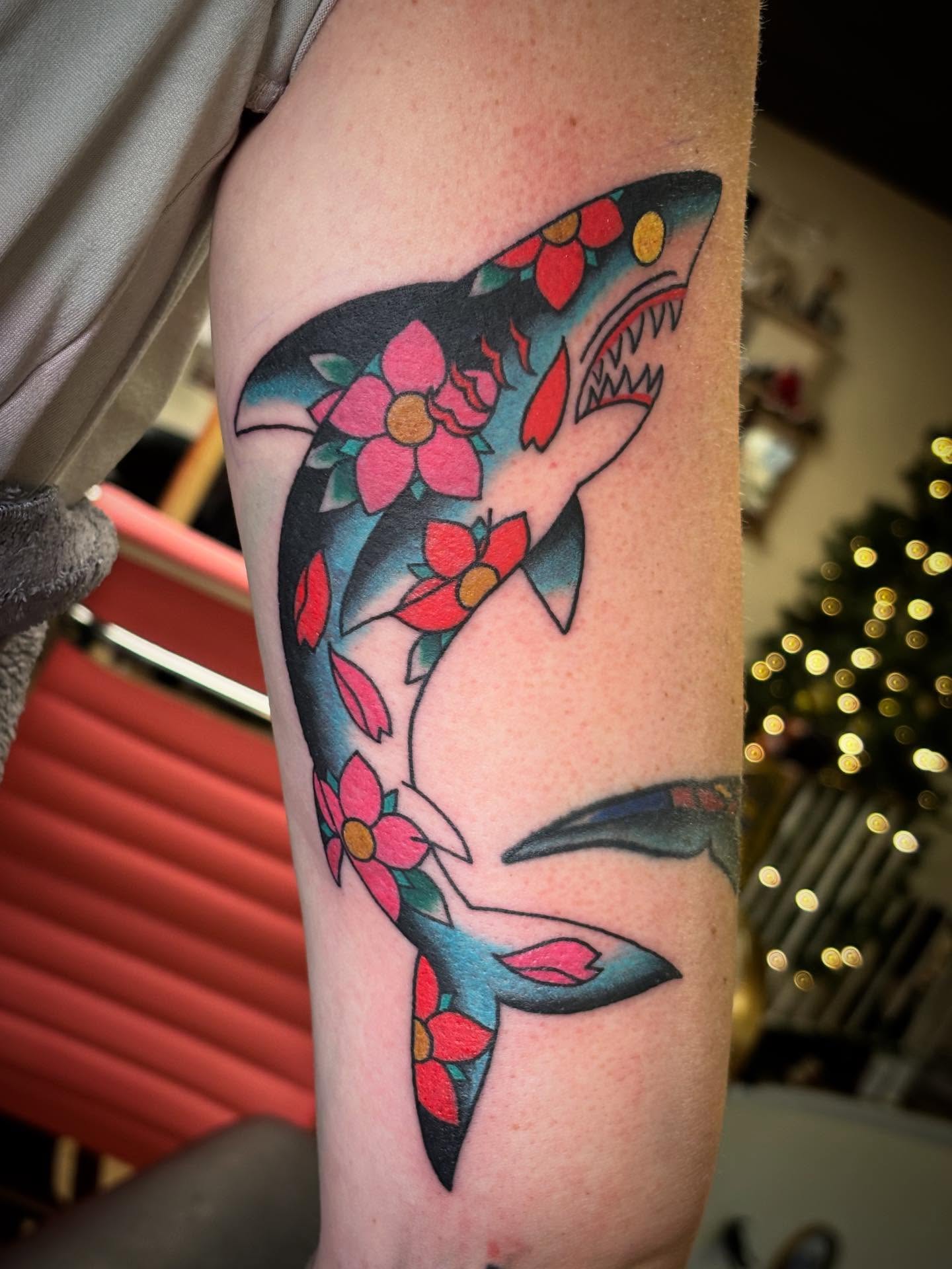 Shark with floral patterns new school tattoo on the forearm by Tyler Whalen