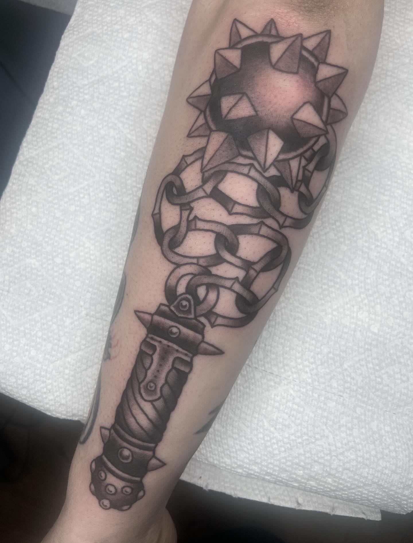 Knife and spikes geometric tattoo on the forearm by nicholas mcevoy, Boston, Massachusetts