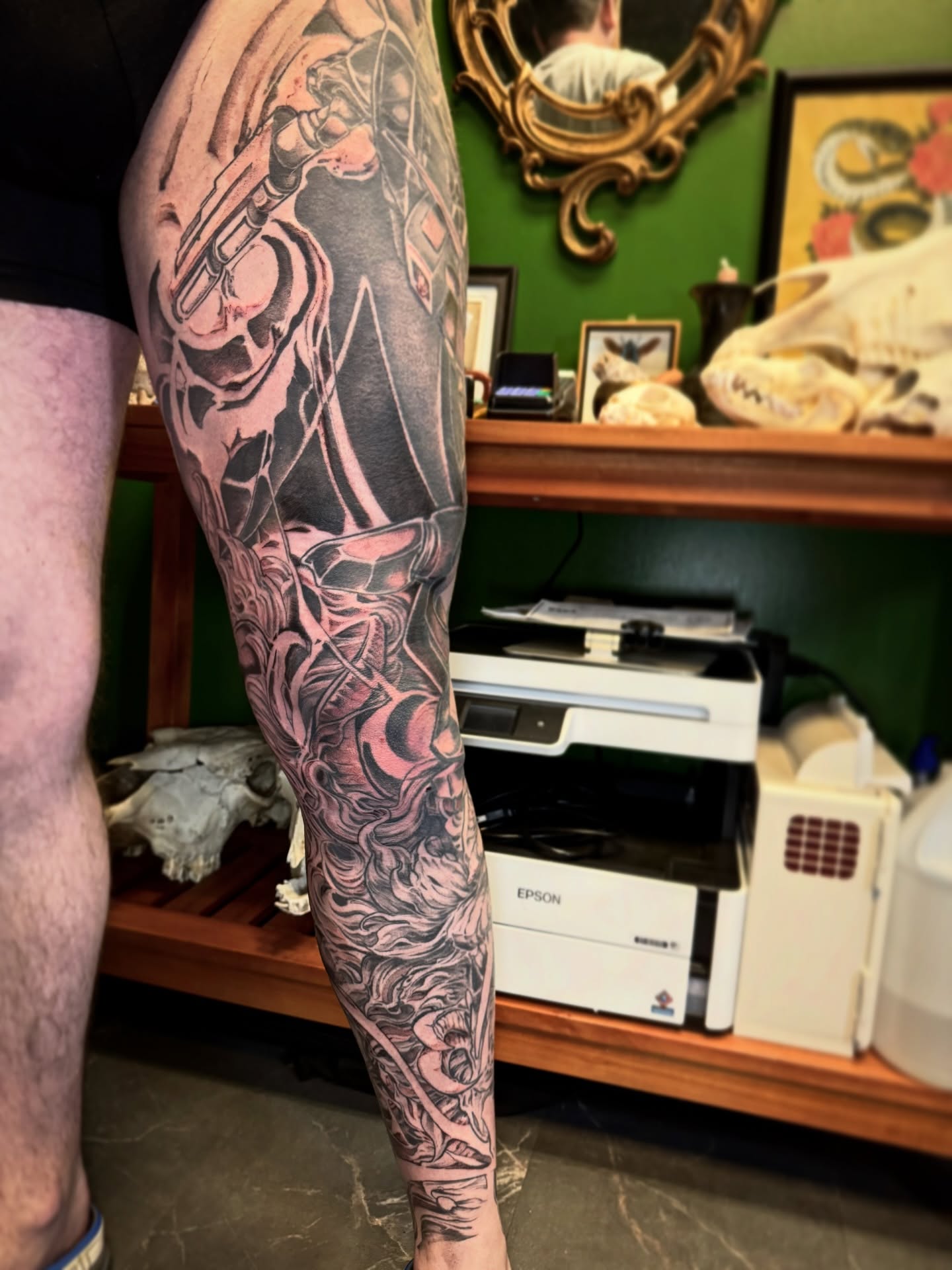 Mechanical figure realism tattoo on the forearm by Joe Hall