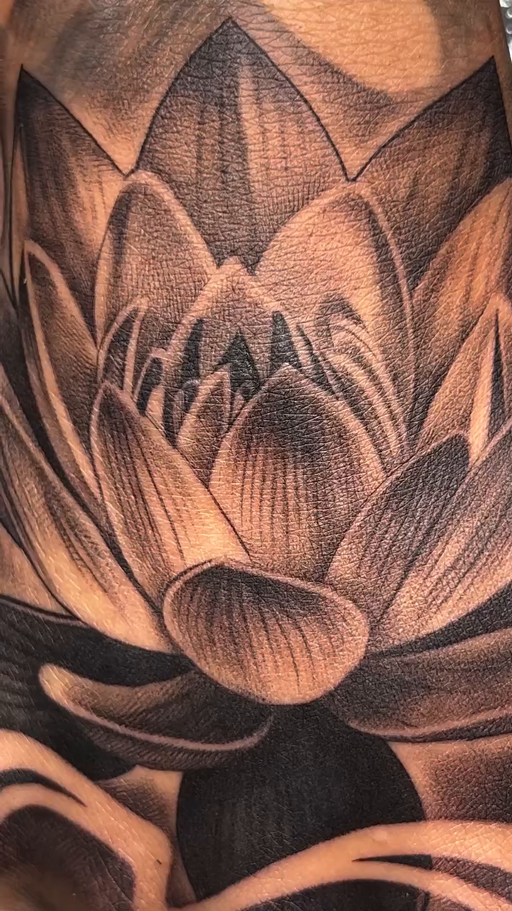 Lotus flower realism tattoo by Imarea Rivera