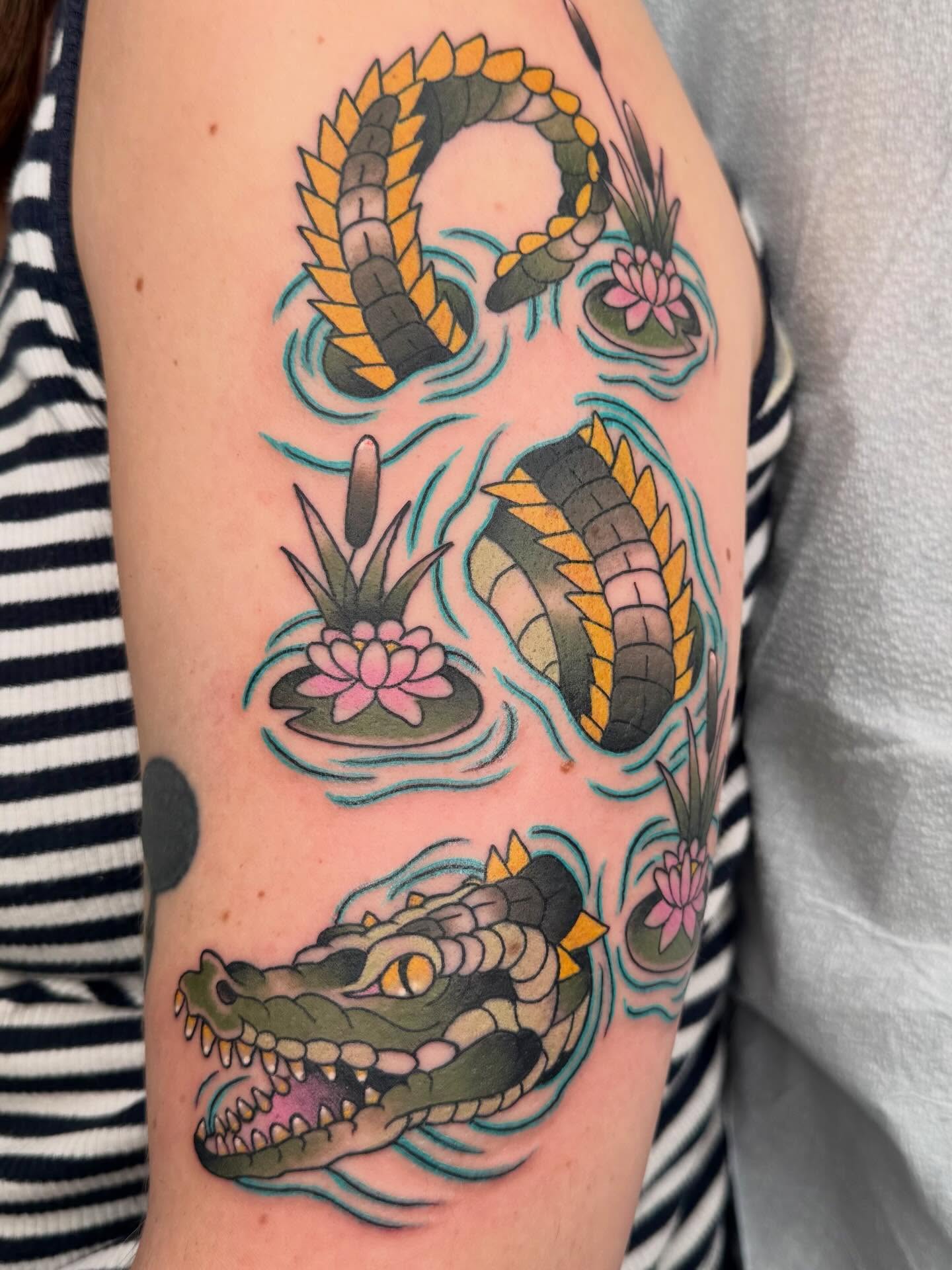 Alligator and lotus American traditional tattoo on the forearm by Curtis Stairs, Seattle, Washington