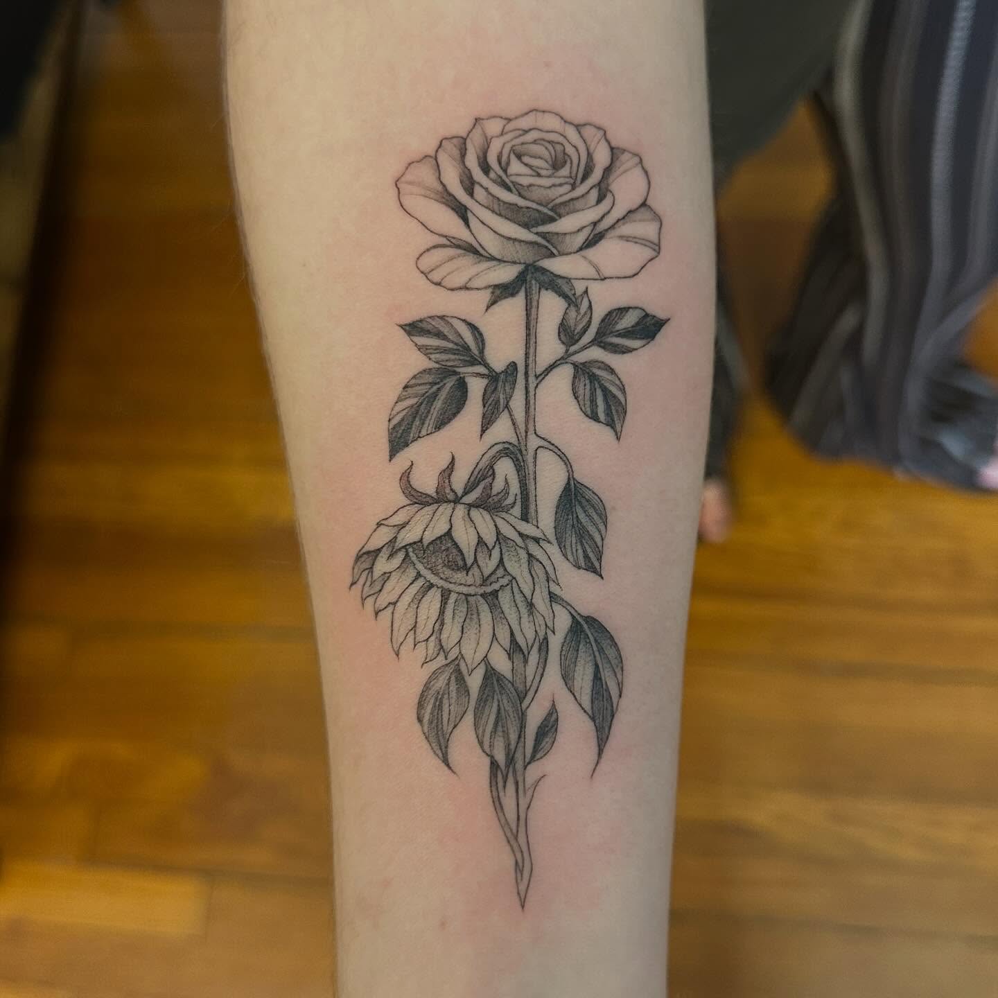 Rose and sunflower black and grey tattoo on the forearm by Raul Najera Tattoo, Plano, Texas