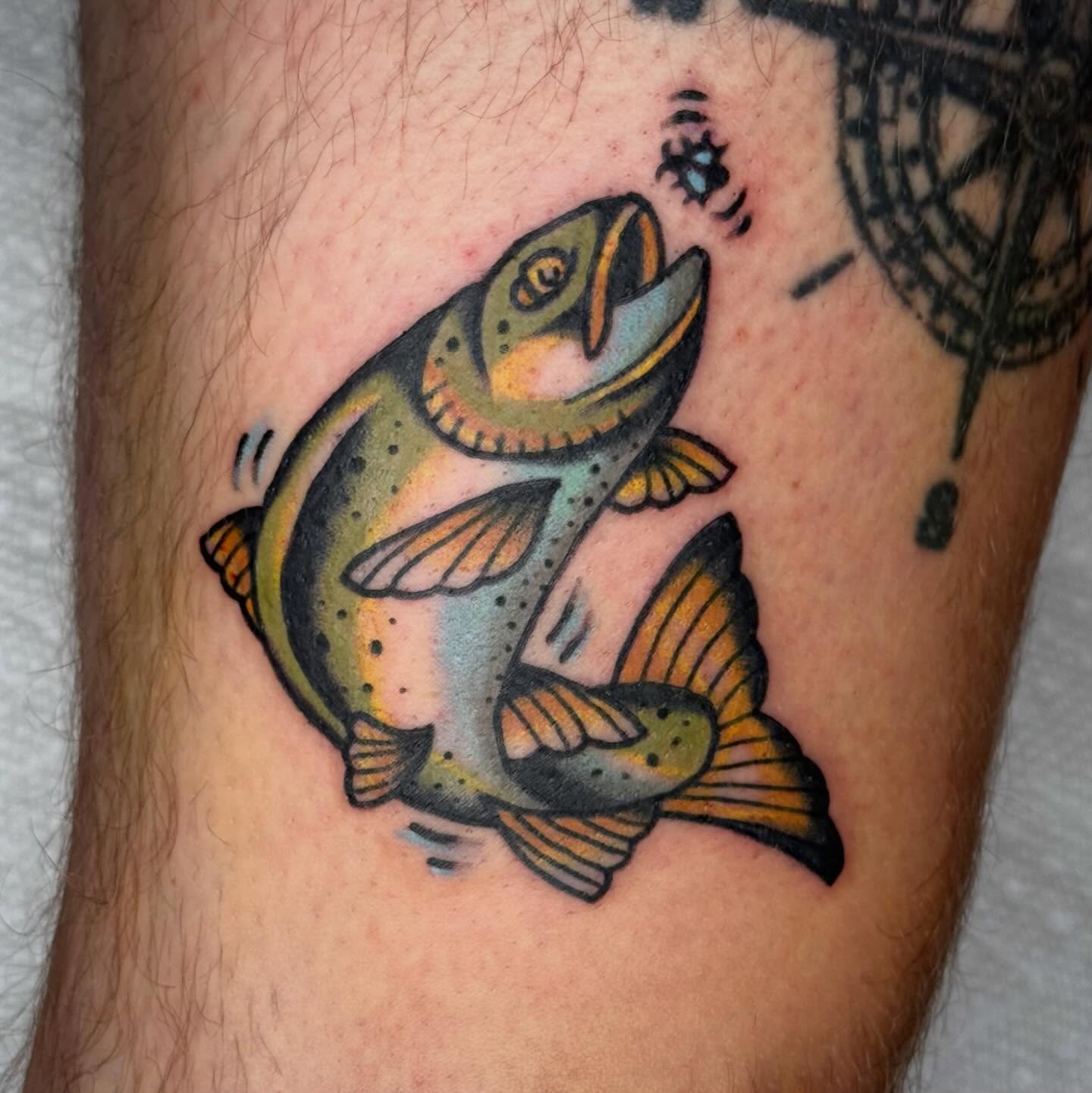 Rainbow trout American traditional tattoo on the forearm by Ty Elias
