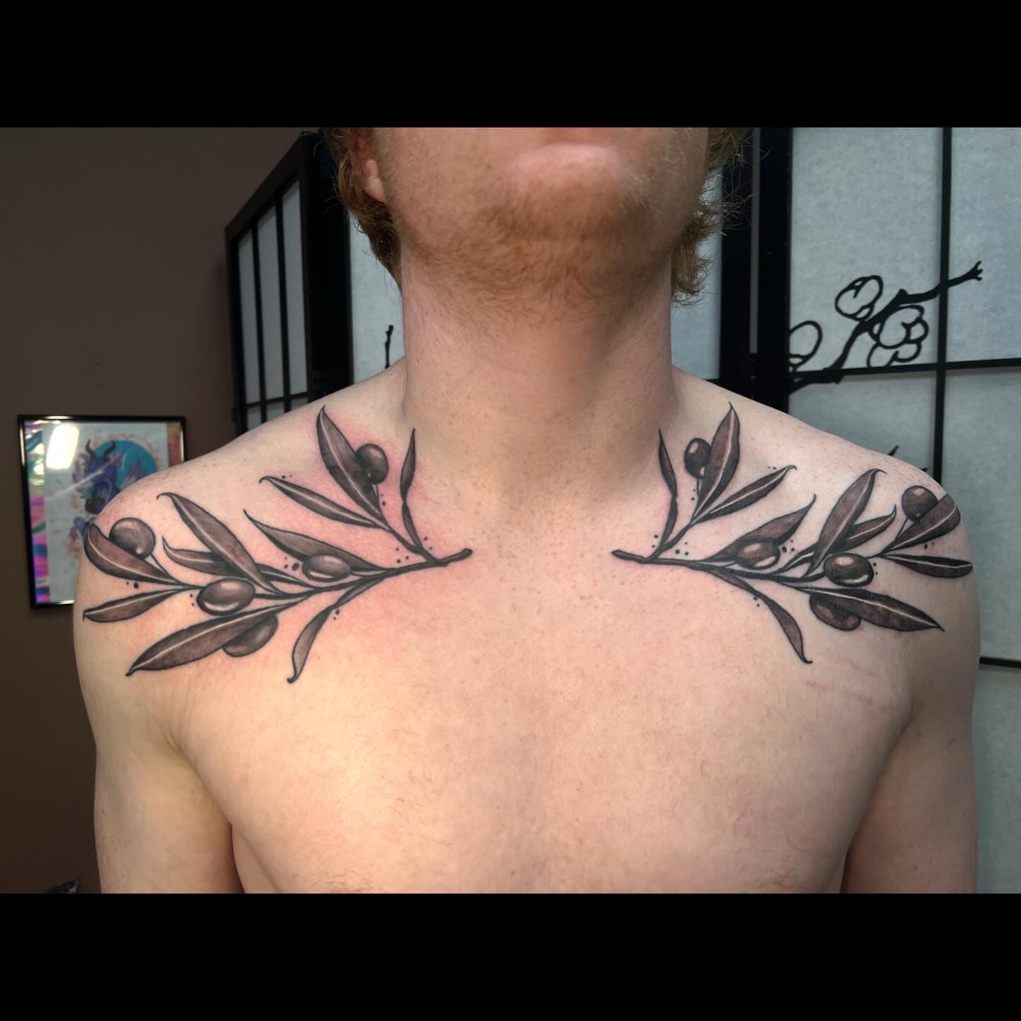 Olive branch black and grey tattoo on the chest by Ali, Cedar Rapids, Iowa