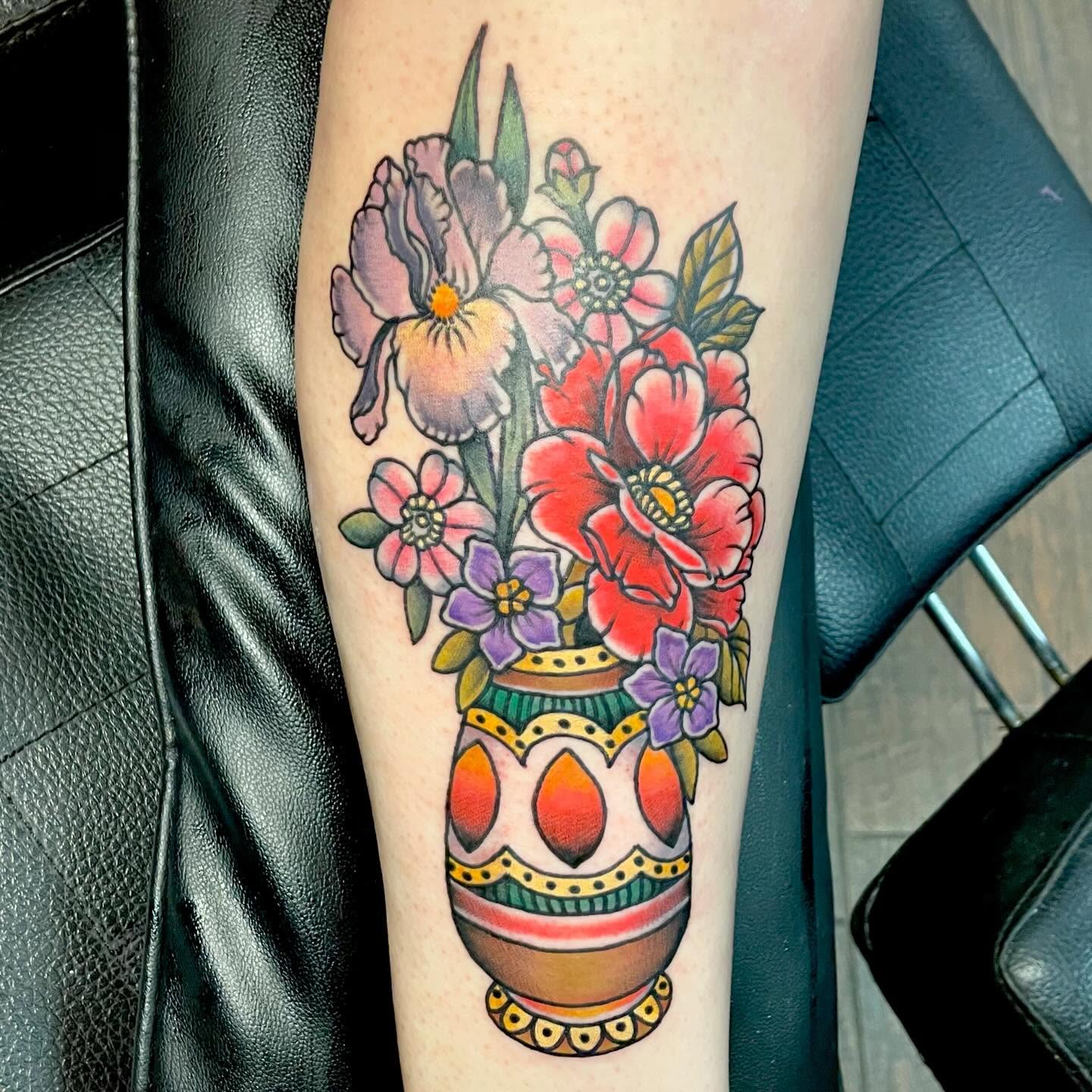 Flower bouquet American traditional tattoo on the forearm by Jessi Kilpatrick
