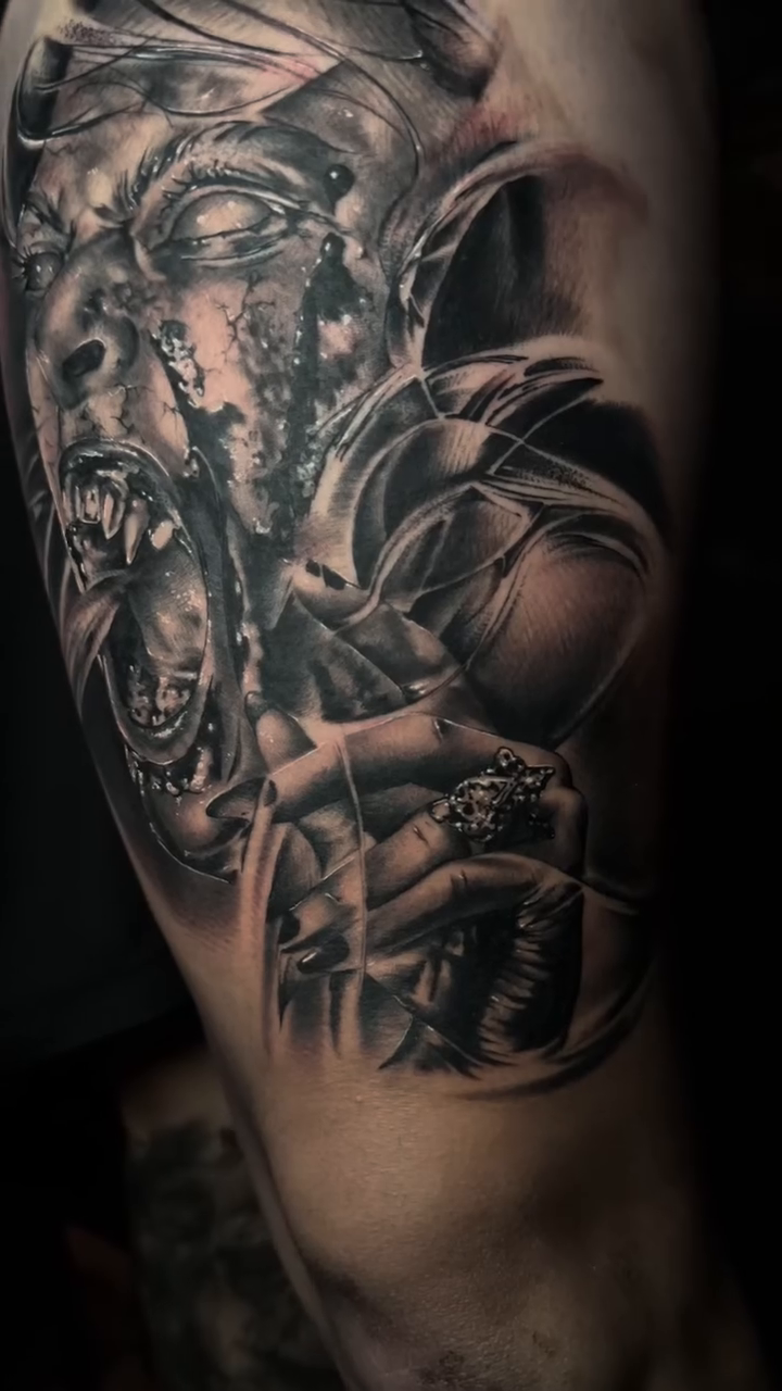 Screaming face with multiple eyes dark realism tattoo by Daniel Gonzalez