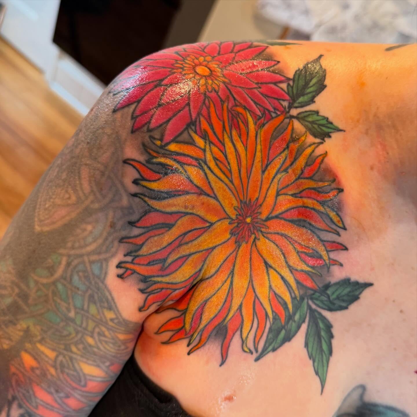 Dahlia flowers new school tattoo on the shoulder by Laura Saadati Kepper