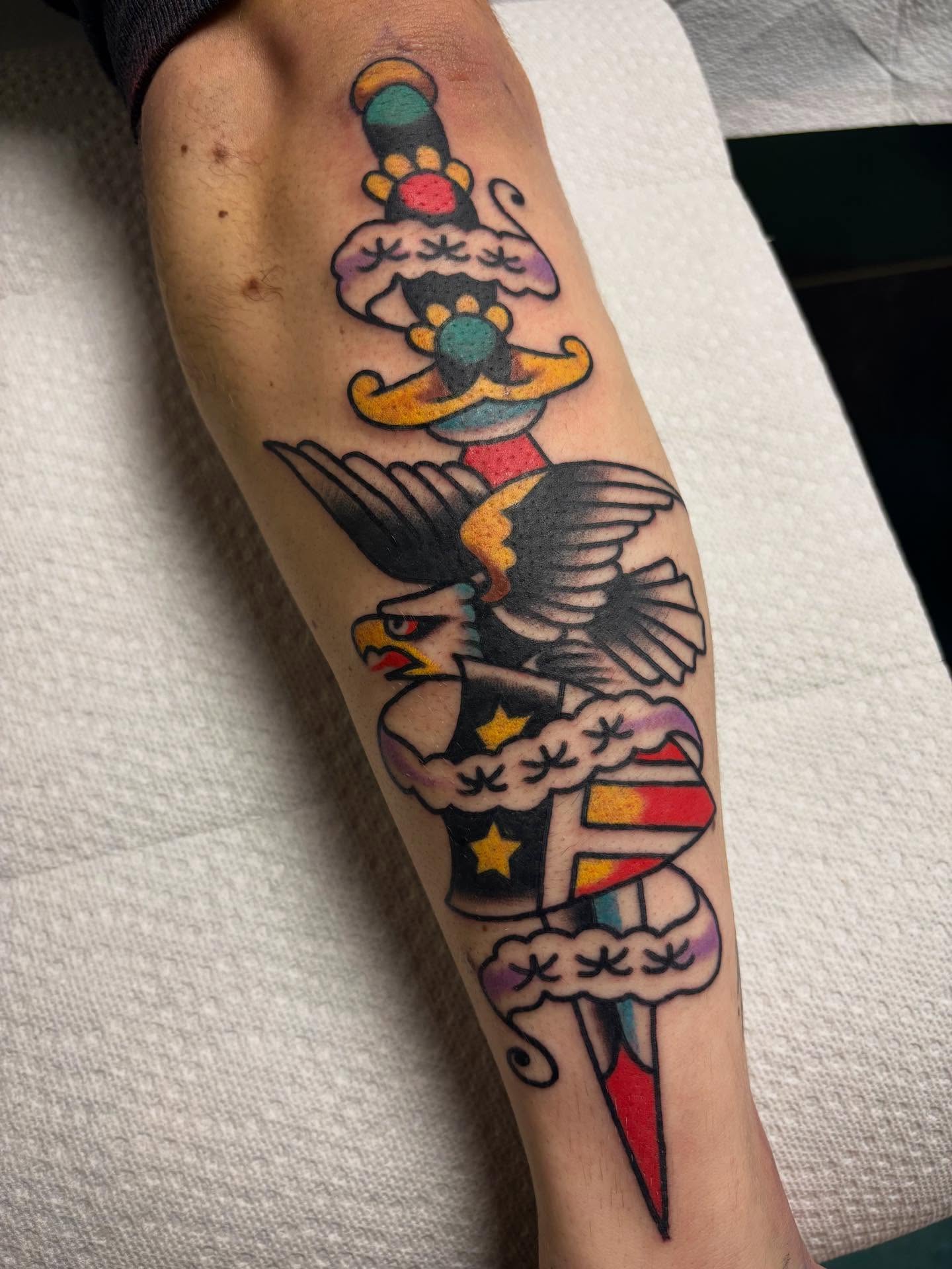 Eagle and circus motifs American traditional tattoo on the forearm by 🌹
