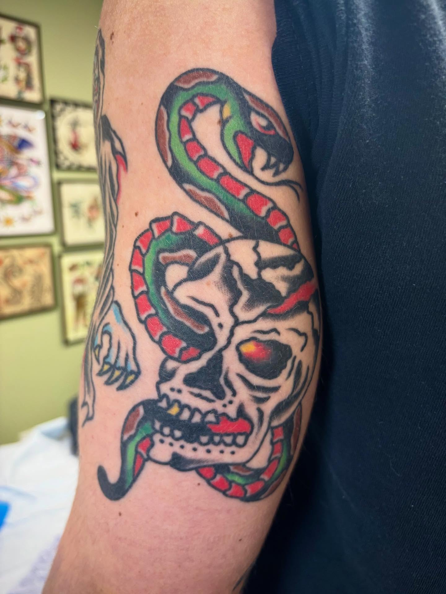 Skull with snake American traditional tattoo on the forearm by 🌹