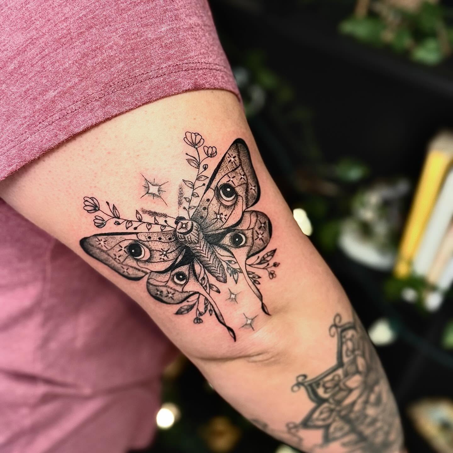 Butterfly black and grey tattoo on the forearm by Haley Bates