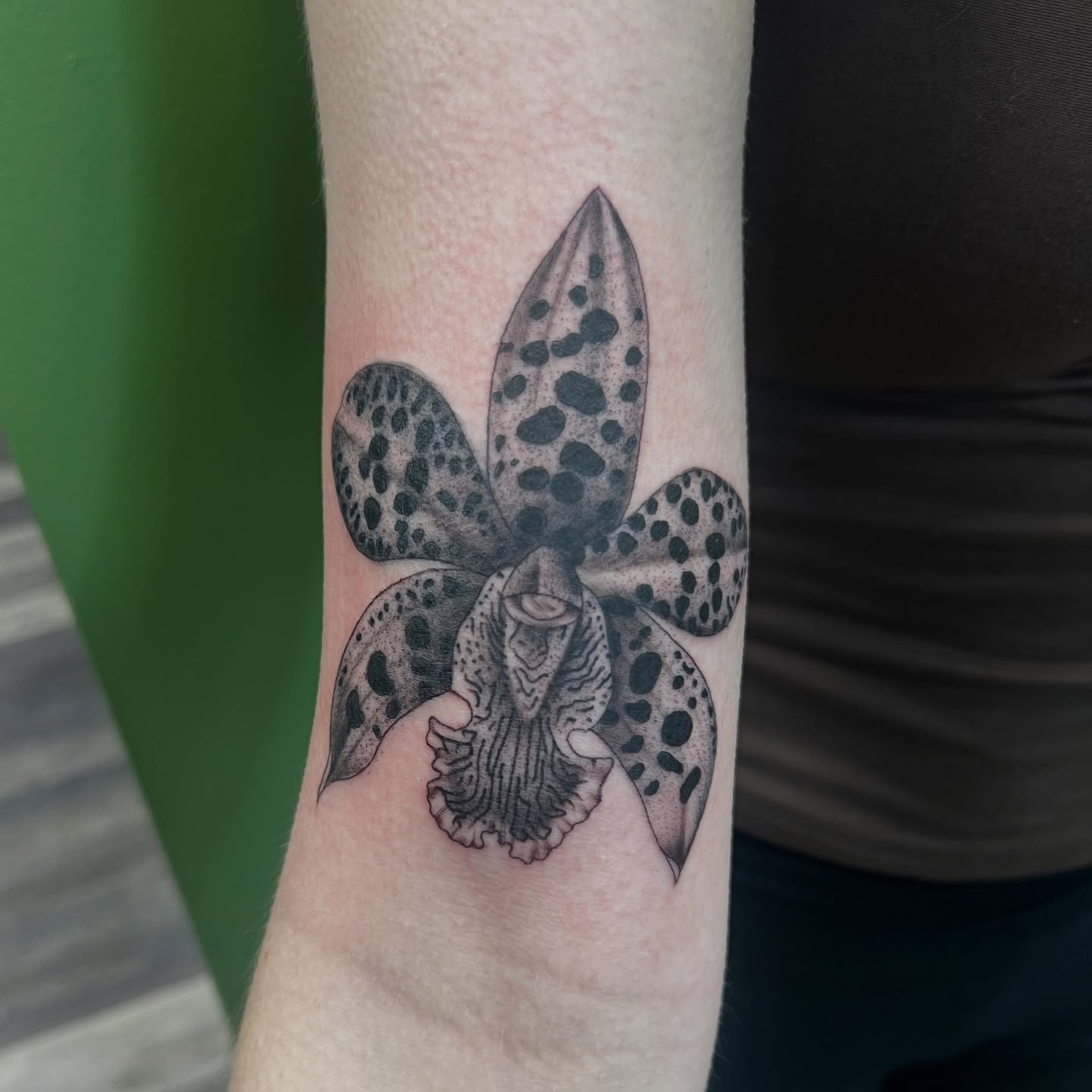 Orchid dotwork tattoo on the forearm by Olivia Suzanne Fada