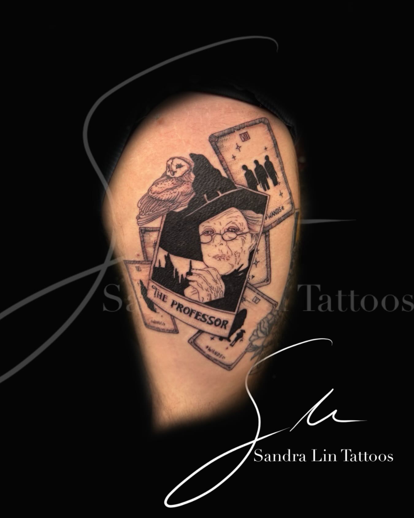 Professor realism tattoo on the upper arm by Sandra Lin Cue