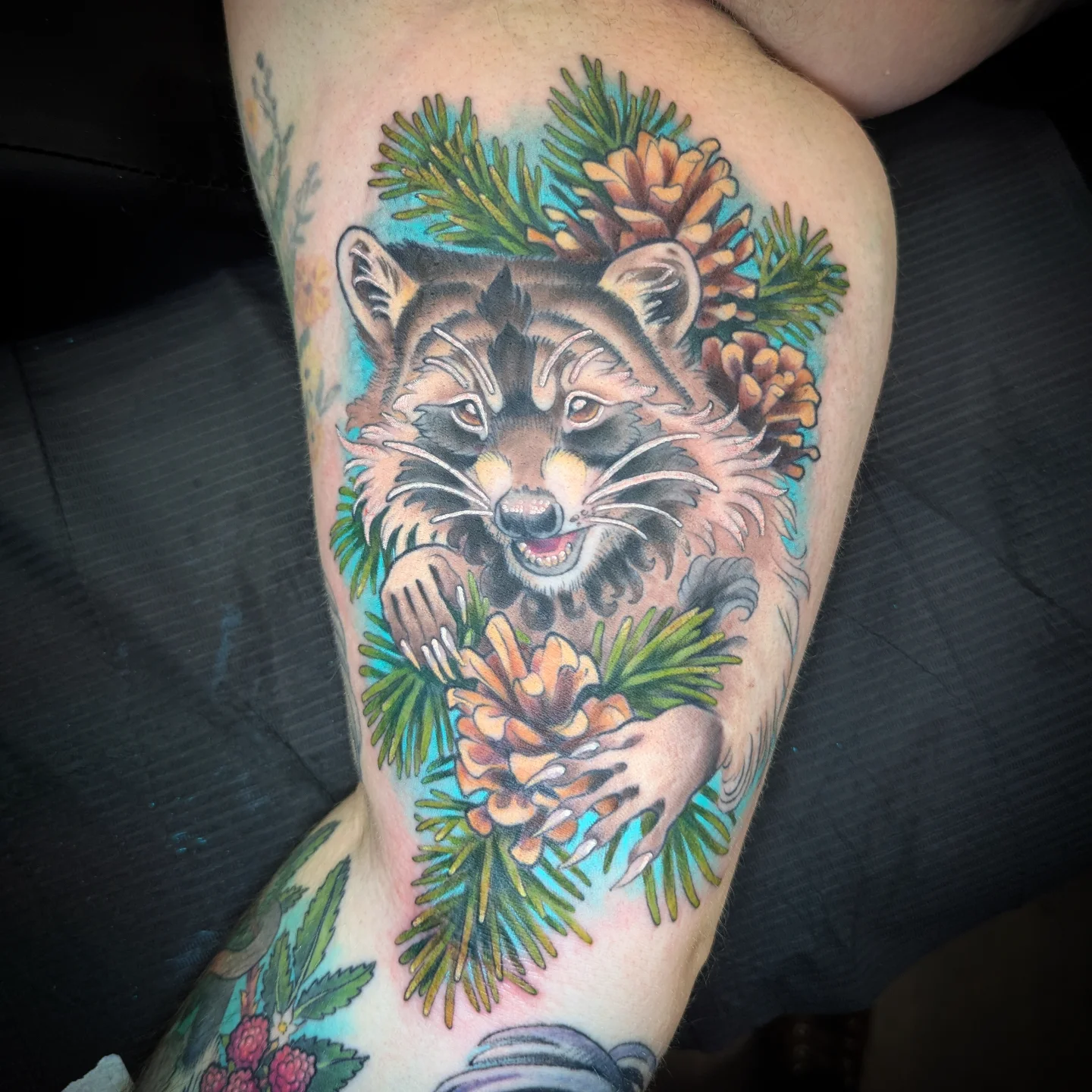 Raccoon American traditional tattoo on the thigh by Devon Greig