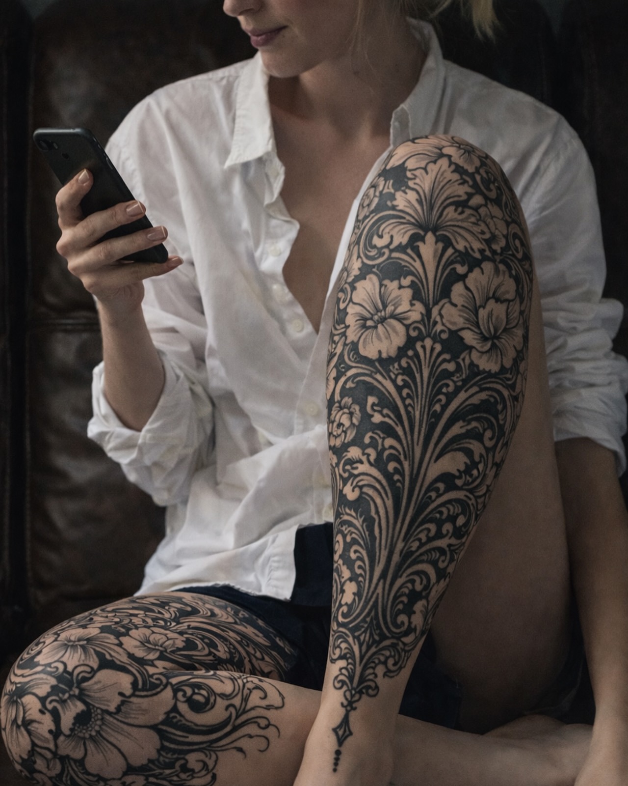 Floral pattern black and grey tattoo on the upper arm by David Garner, Los Angeles, California
