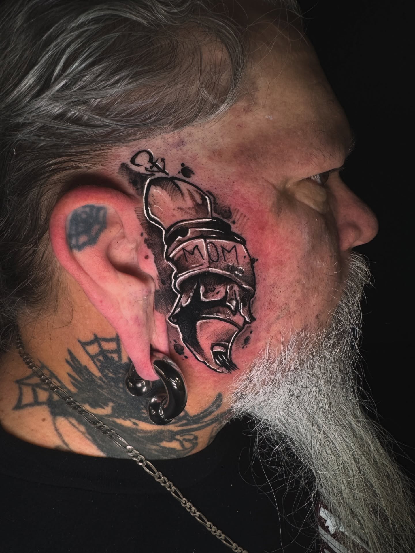 Helmeted warrior black and grey tattoo on the head by Donald Reynolds
